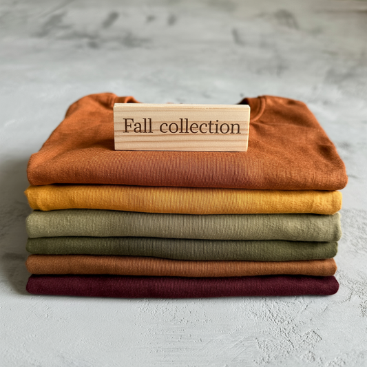 Close-up of a neatly stacked pile of folded textiles, showcasing the intricately woven patterns and textures, symbolizing comfort and style from FireBrook Essentials.