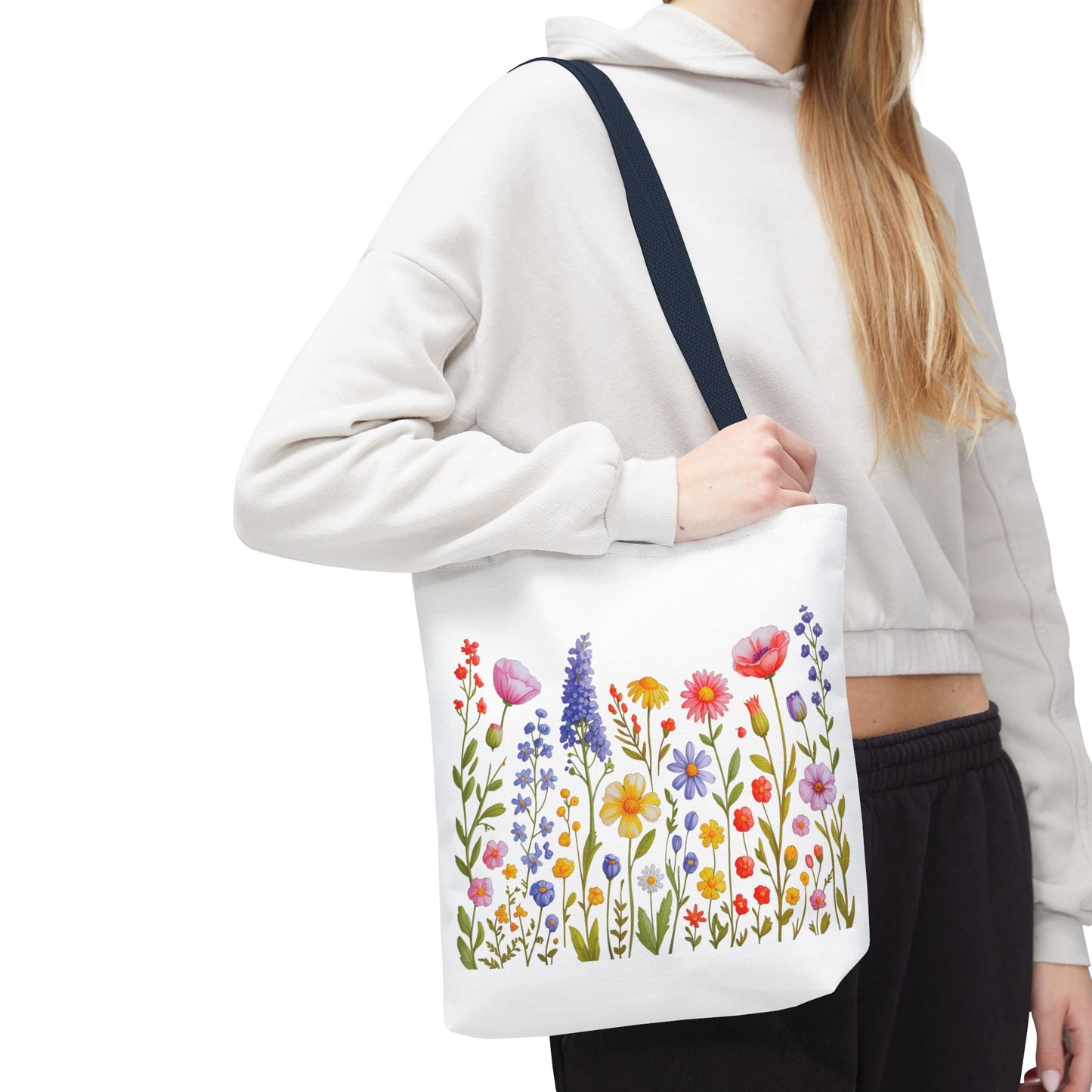 Wildflowers Tote Bag featuring a vibrant wildflower design, perfect for nature enthusiasts. Constructed from durable polyester with reinforced handles, ideal for daily use. Available in three sizes for versatile needs.