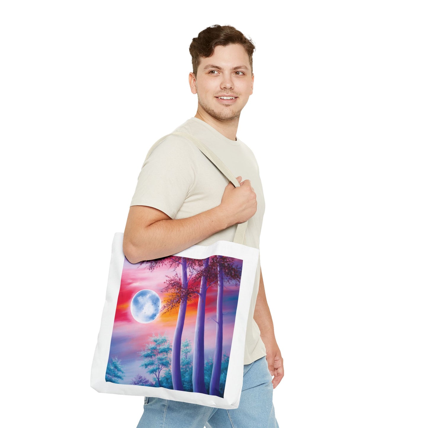 Moonlit Forest Tote Bag features a mystical full moon scene with trees against a sunset sky, embodying both art and nature, perfect for everyday use or as a unique gift.