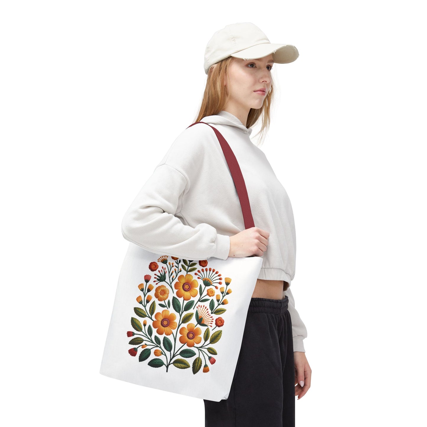 Folk Art Floral Faux Embroidery Style Tote Bag showcases a vibrant floral pattern in warm earth tones, embodying a relaxed, artistic vibe. Ideal for everyday use, it reflects FireBrook Essentials' uplifting design ethos.