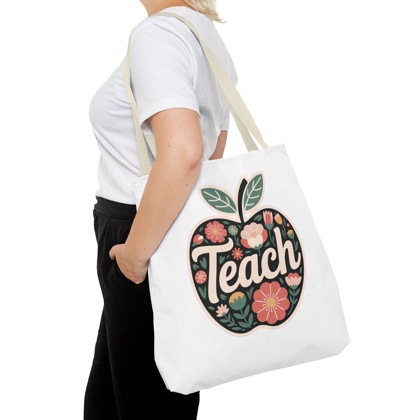Floral Apple Tote Bag - Hand-Drawn Pastel-Colored Design with 'TEACH', showcasing a cheerful apple shape filled with floral illustrations. Offers durability, reinforced handles, and spacious boxed corners. Perfect for educators and nature enthusiasts.