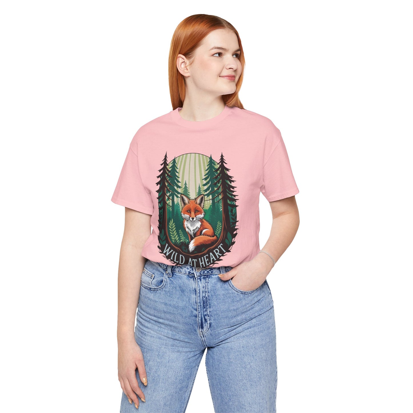 Wild at Heart Fox Illustration Bella+Canvas Unisex T-Shirt featuring a cartoon fox and trees design, worn by a woman in casual attire for a stylish, nature-inspired look.