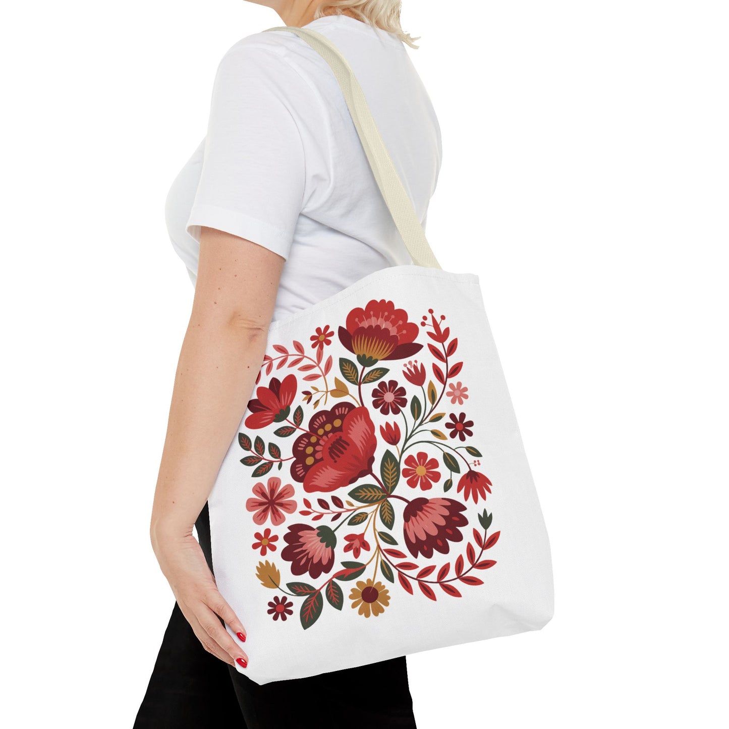 Red Floral Folk-Art Style Tote Bag, featuring vibrant red and blush floral illustrations with green leaves, ideal for art lovers. Durable polyester with reinforced handles, perfect for everyday use.
