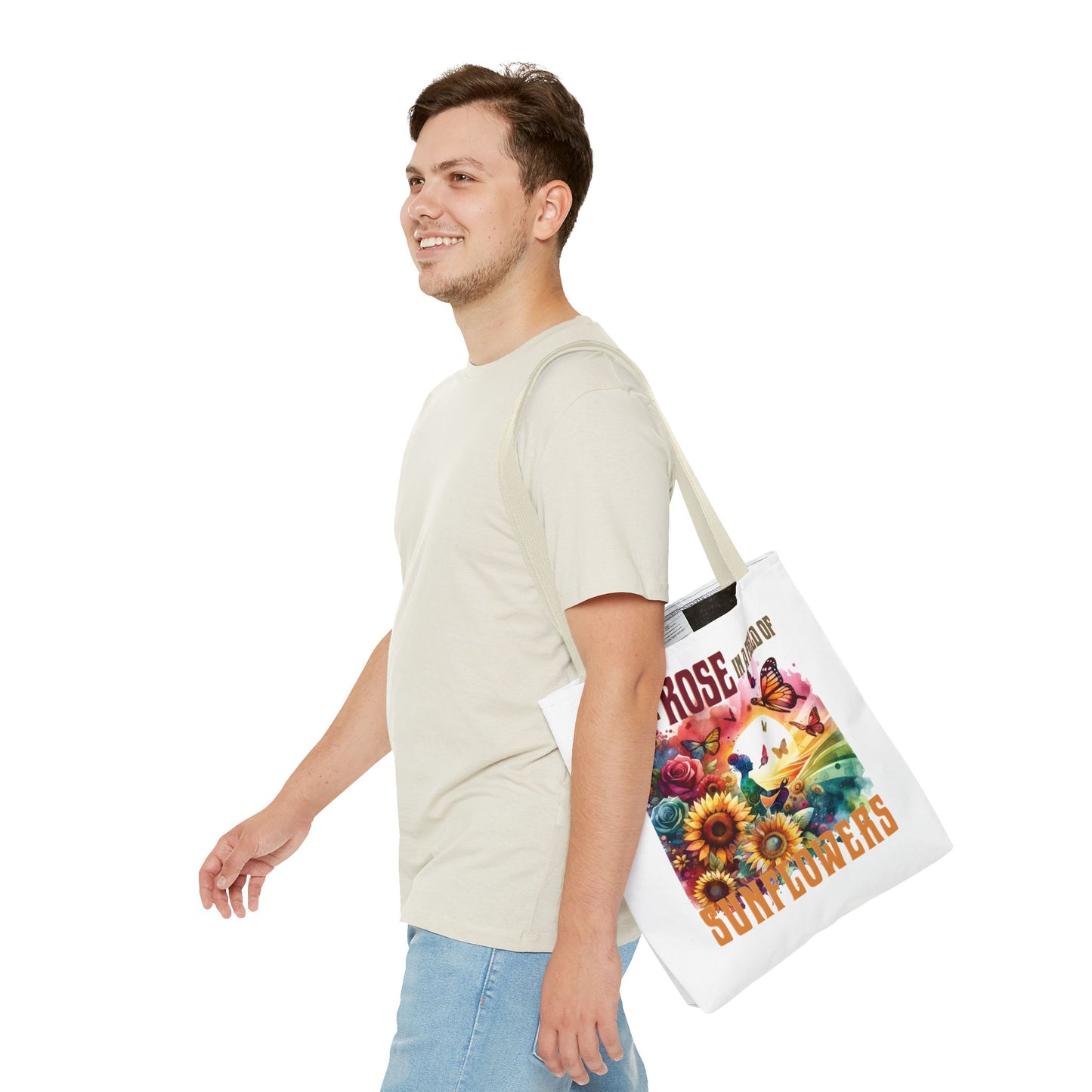 Be the Rose in a Field of Sunflowers Tote Bag held by a smiling man, showcasing its roomy design and durable handles for everyday use.