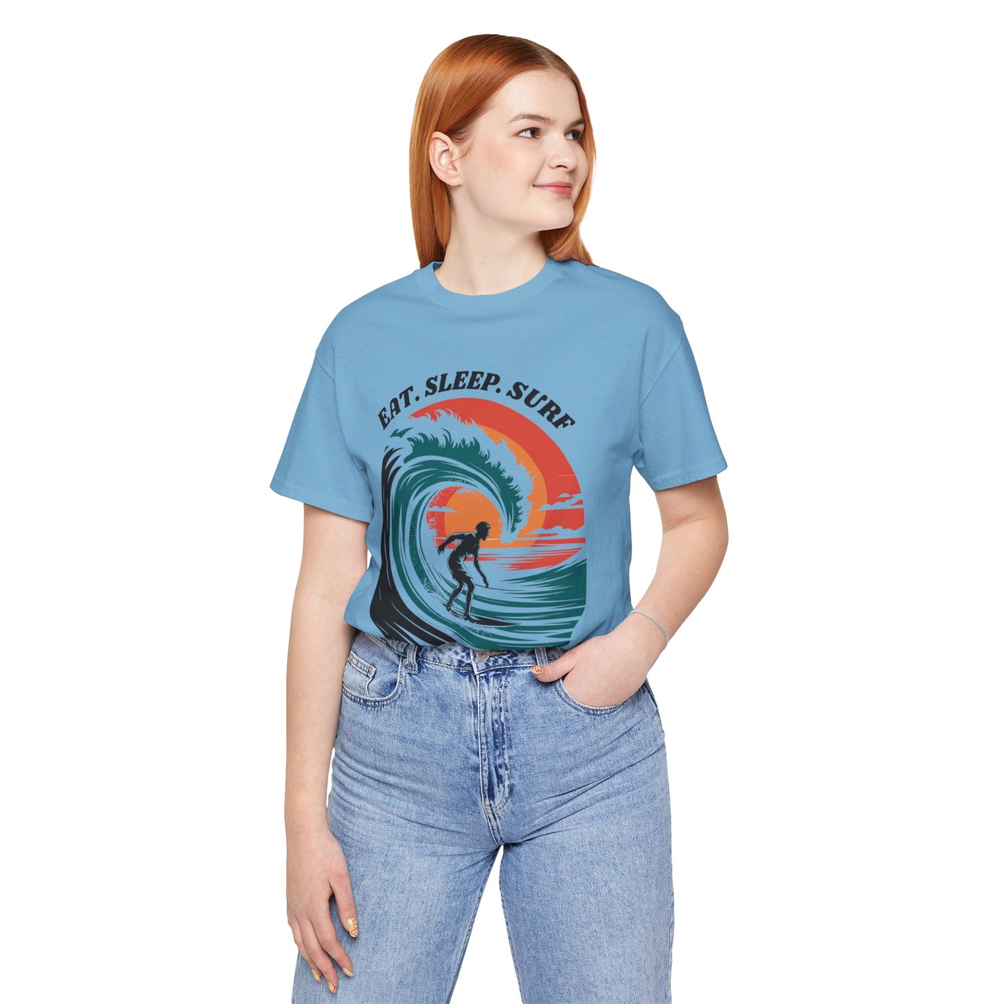 Surf Tee - Eat Sleep Surf Design: A casual, beachy vibe tee featuring the 'Eat Sleep Surf' motif, worn by a woman. Ideal for surf enthusiasts, crafted for comfort and style by FireBrook Essentials.