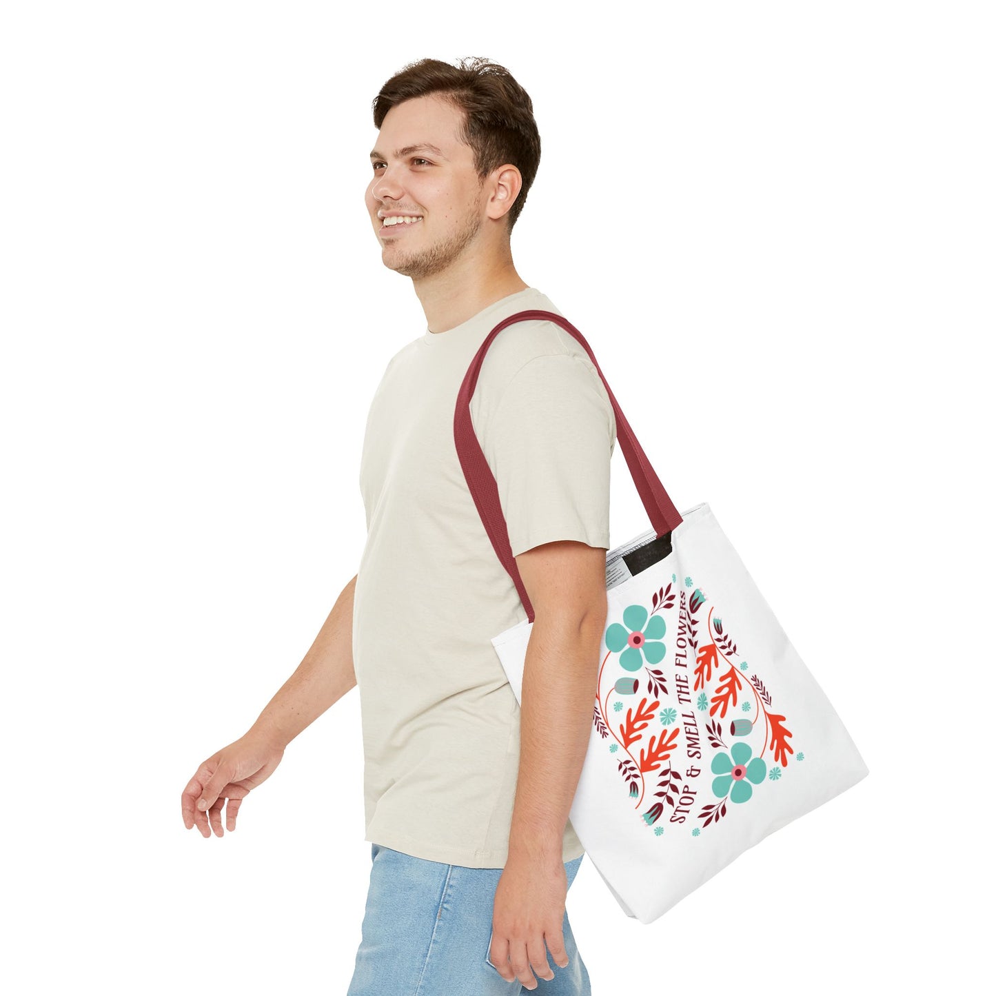 Stop and Smell The Flowers Tote Bag carried by a smiling man, highlighting its floral design and functionality for daily essentials.