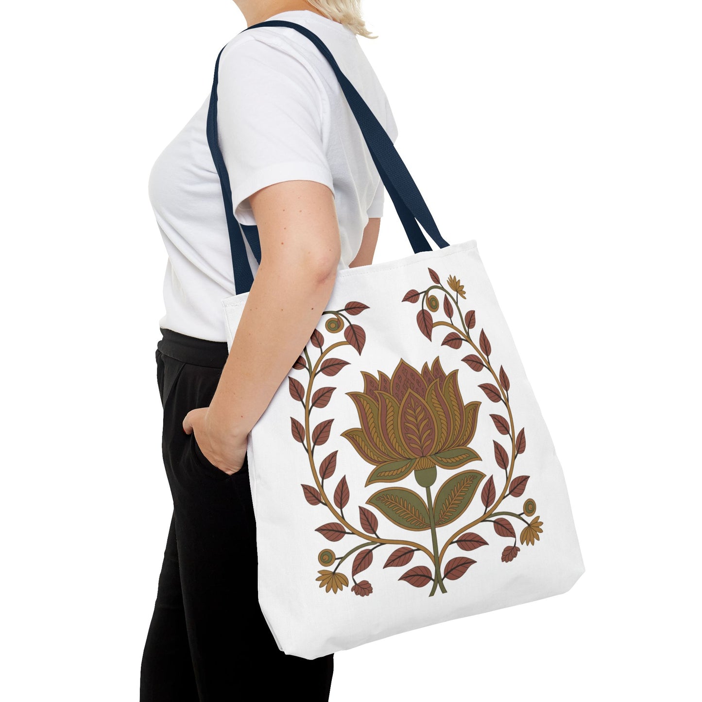 Earth Tote Bag with Floral Vines and Traditional Motifs being held, showcasing floral designs and swirling patterns, emphasizing its spacious, stylish, and durable construction, perfect for daily use and gifting.
