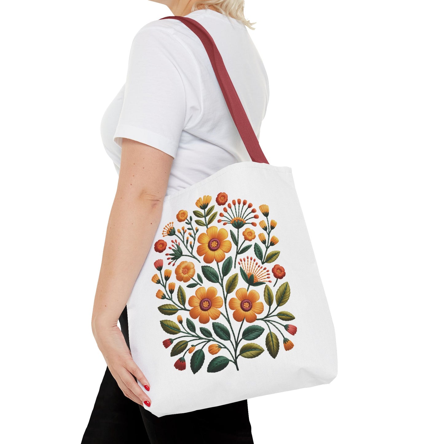 Folk Art Floral Faux Embroidery Style Tote Bag with mustard and sunflower flowers, olive leaves, and coral accents in a bold vector design, perfect for carrying essentials with artistic flair.