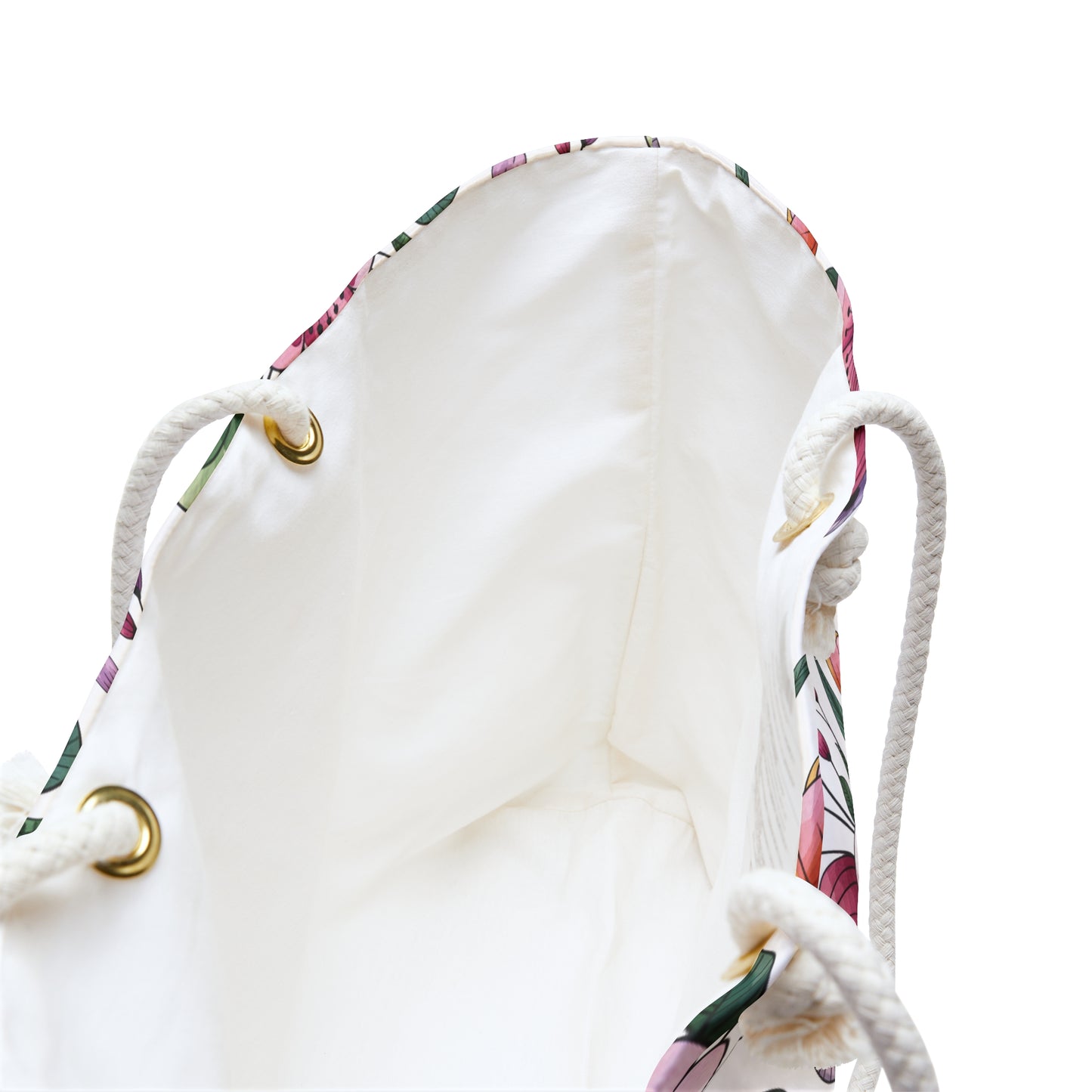 Botanical Weekender Bag with a playful floral and leaf pattern, featuring sturdy rope handles and metal grommets, ideal for whimsical travel, reflecting FireBrook Designs' commitment to joyful, stylish accessories.
