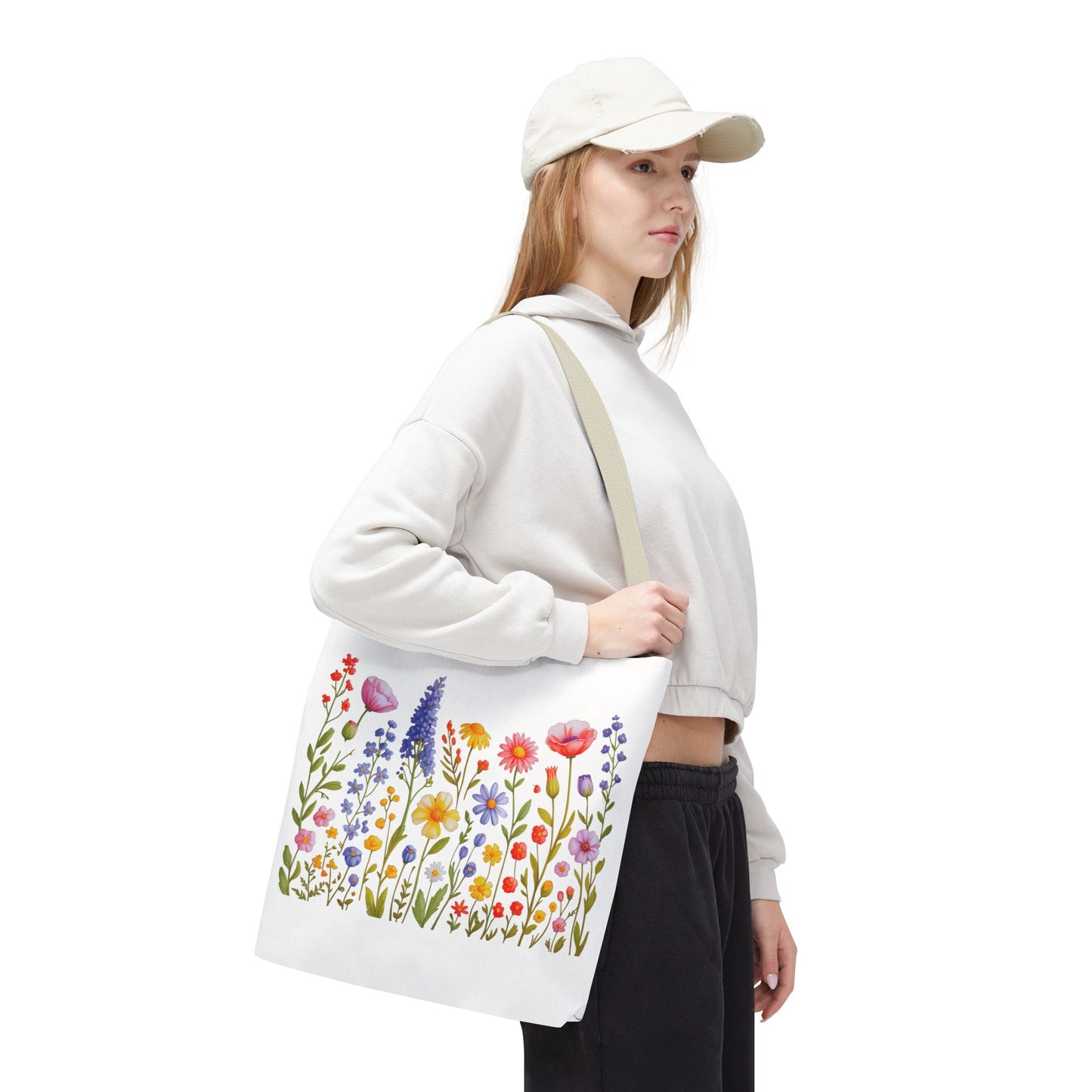 Wildflowers Tote Bag featuring a vibrant wildflower design, ideal for nature lovers. Made from durable polyester, this versatile tote offers reinforced handles and boxed corners, perfect for everyday use.