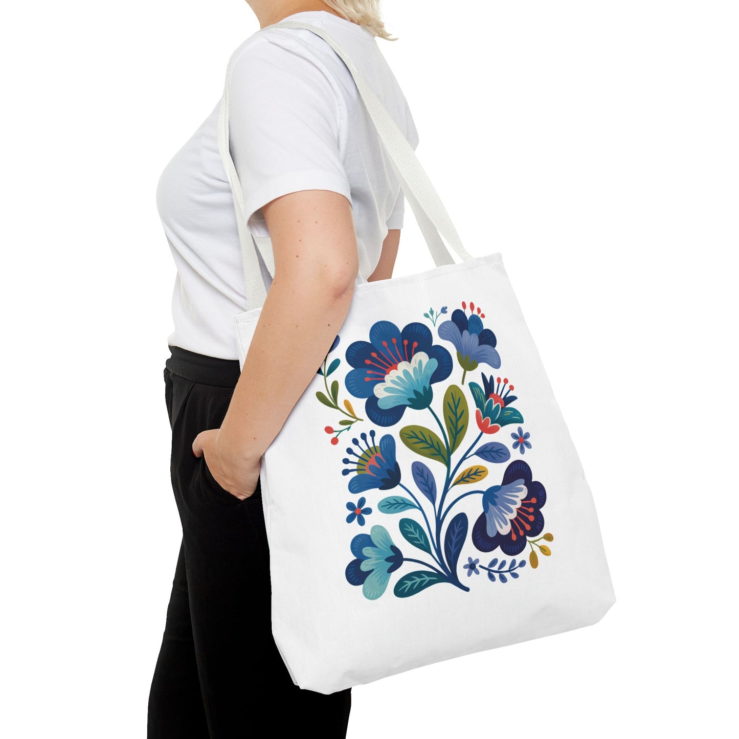 Vintage Folk Art Design Blue Floral Tote Bag with charming floral patterns, ideal for daily use or special occasions. Features durable polyester, black inner stitching, and reinforced handles, embodying FireBrook Essentials' blend of style and joy.
