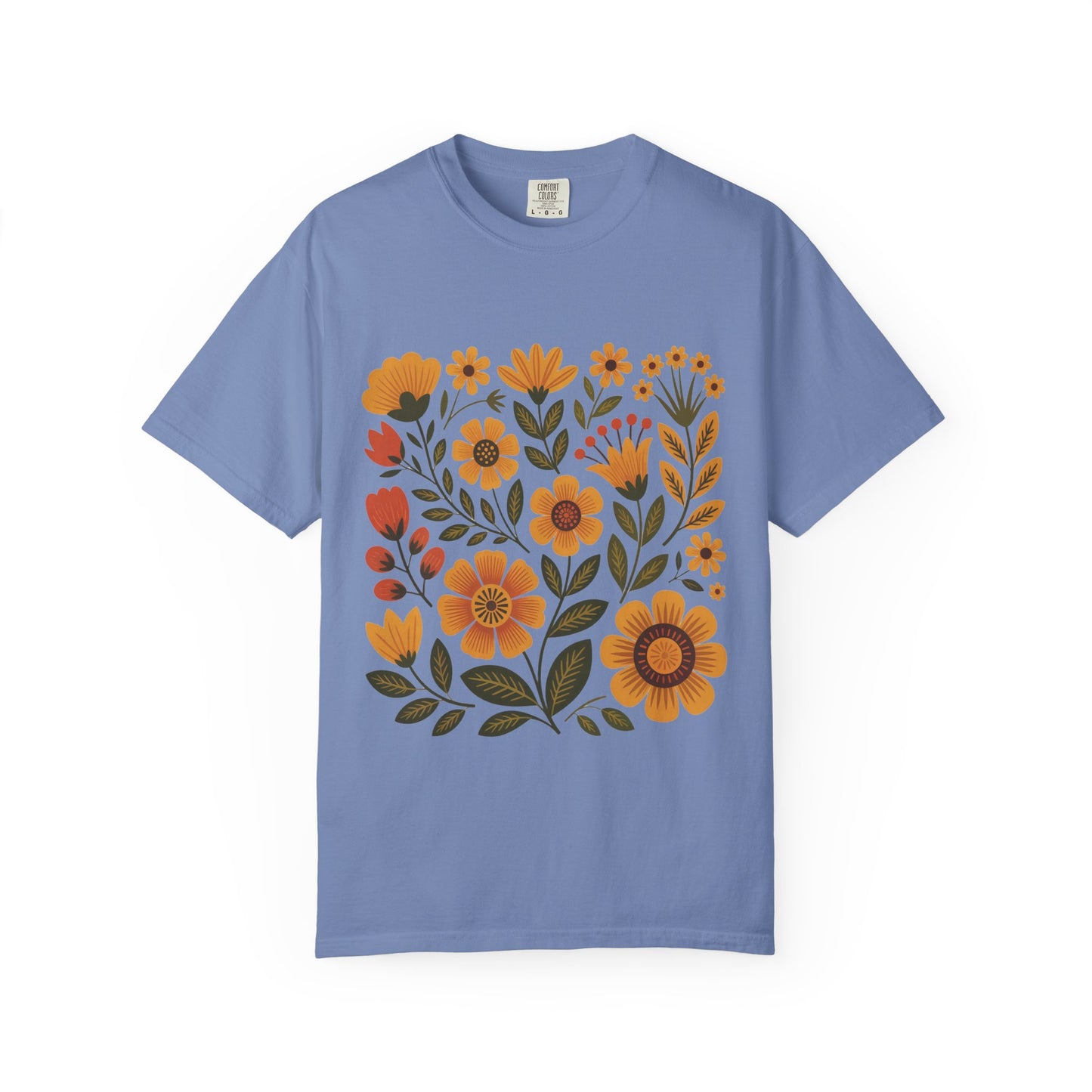 Folk Art in Warm Yellows Floral T-Shirt showcasing an intricate floral design inspired by traditional embroidery, ideal for casual wear. It embodies FireBrook Essentials' commitment to comfort and style, enhancing your wardrobe with artistic flair.