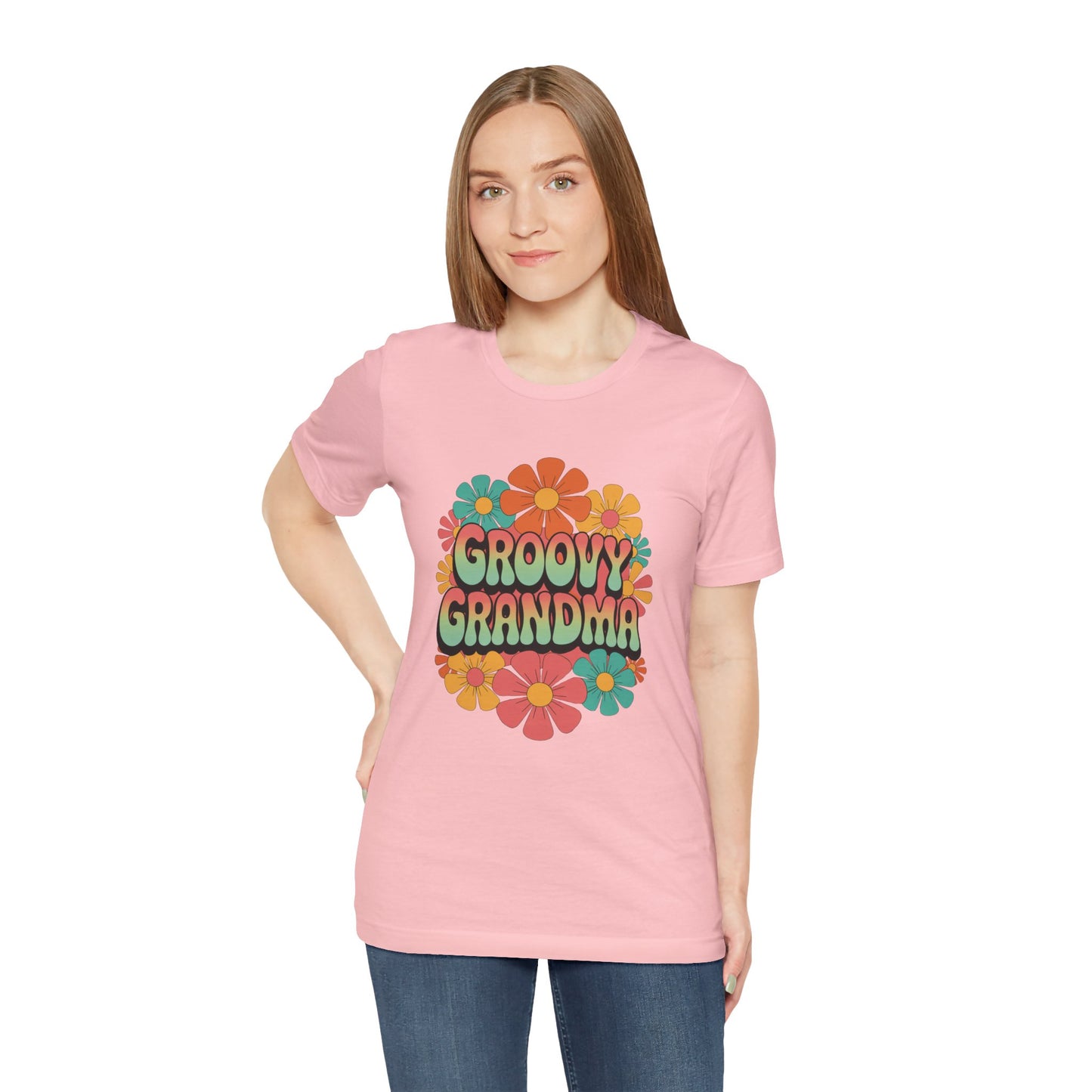 Groovy Grandma for Mother's Day Bella+Canvas Unisex T-Shirt featuring vibrant floral design, worn by a woman in jeans, embodying a playful retro style ideal for vintage enthusiasts.
