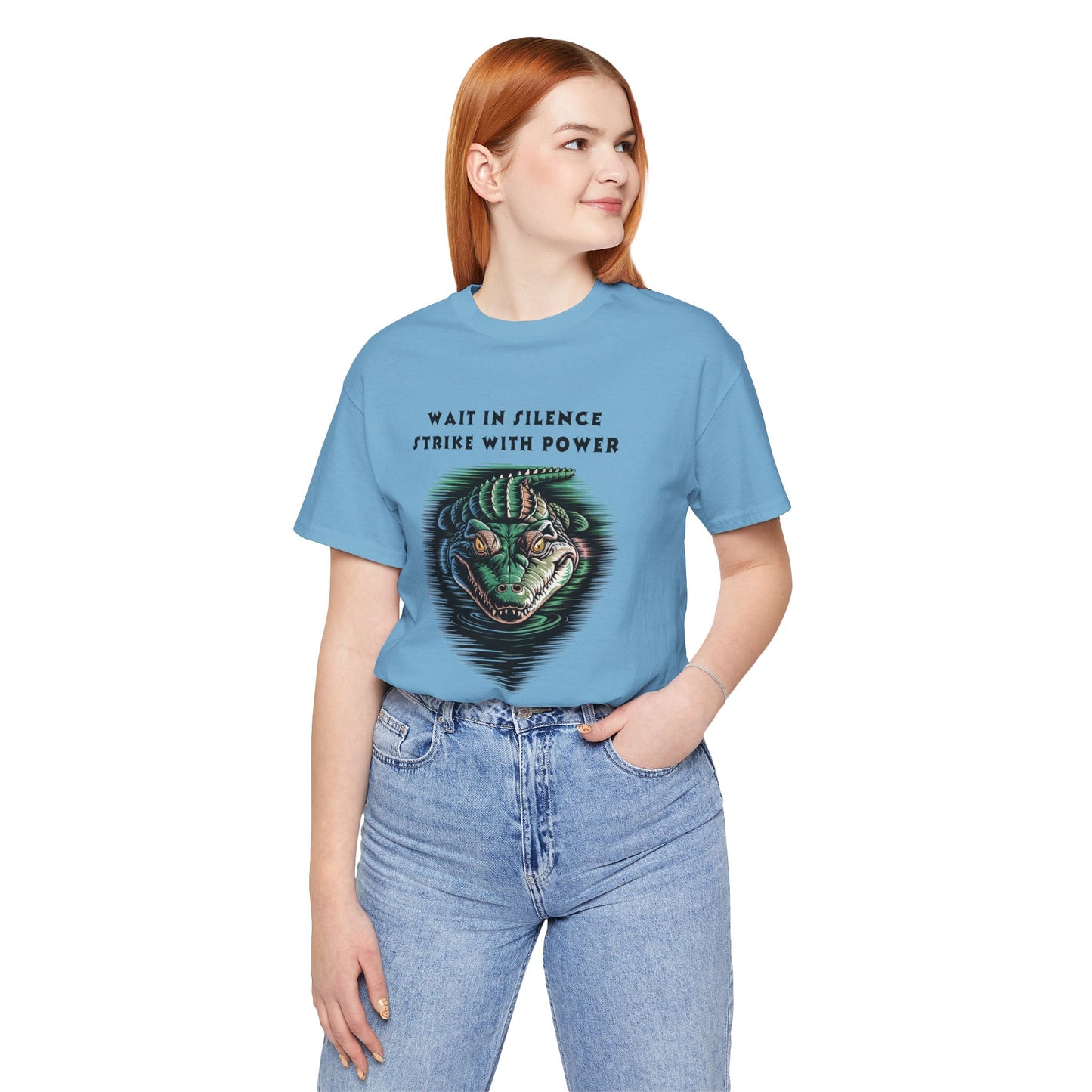 Crocodile: Walk in Silence, Strike with Purpose Bella+Canvas Unisex T-Shirt features a bold crocodile design, worn casually by a woman, embodying stealth and determination, perfect for unique, stylish expressions.