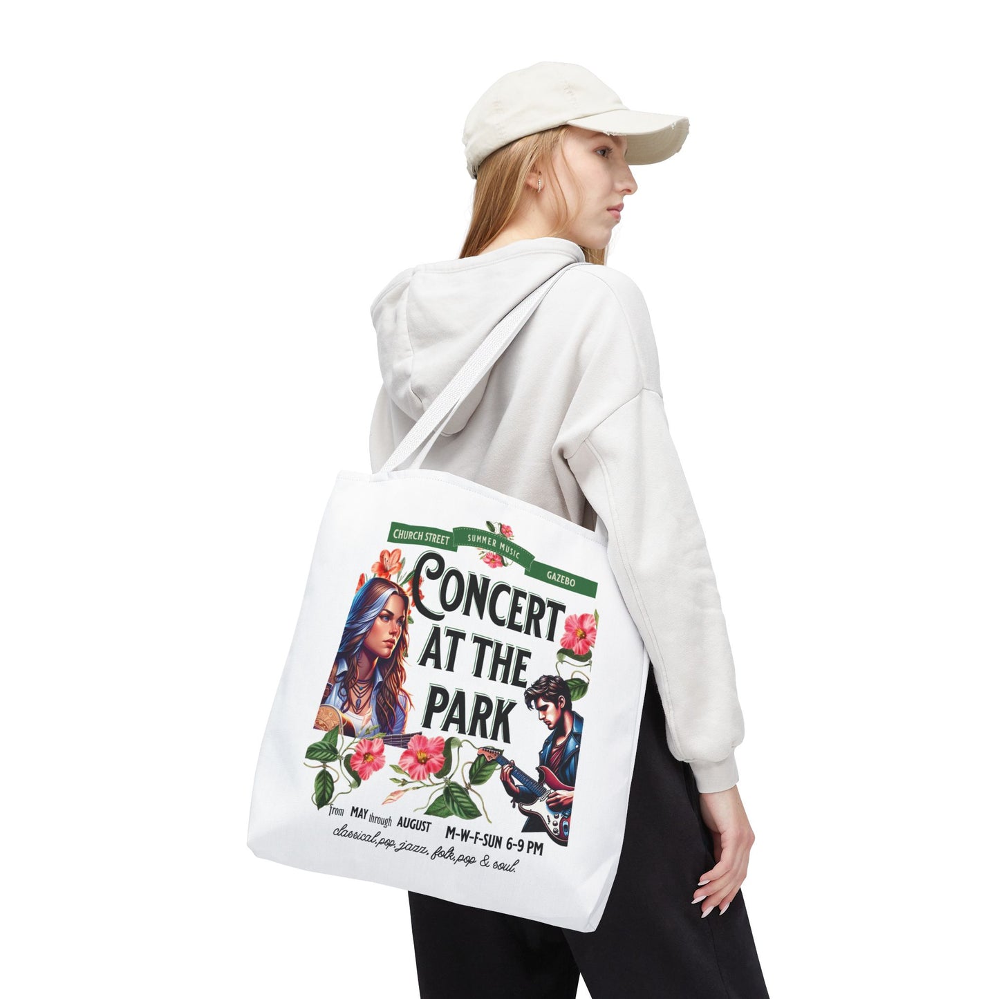 Concert At the Park Tote Bag featuring a lively concert scene, worn by a woman with a white hat, ideal for music lovers and outdoor events.
