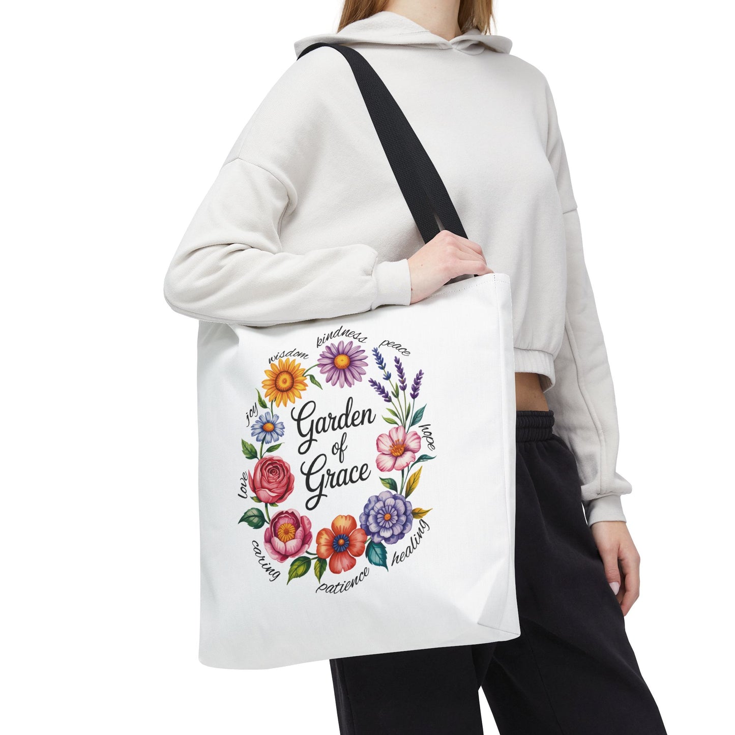 Garden of Grace Watercolor Design Tote Bag features hand-drawn flowers in soft pastels with 'Garden of Grace' text, offering charm and elegance, ideal for daily use or gifting.