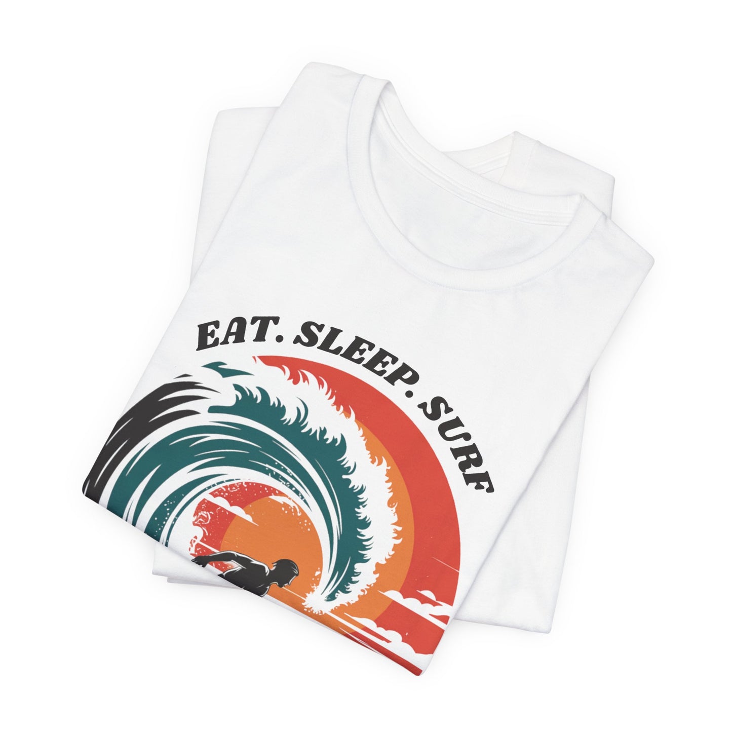 Surf Tee - Eat Sleep Surf Design: A folded white t-shirt featuring a graphic with the phrase Eat Sleep Surf, capturing a laid-back, beachy vibe ideal for surf enthusiasts and beach lovers.