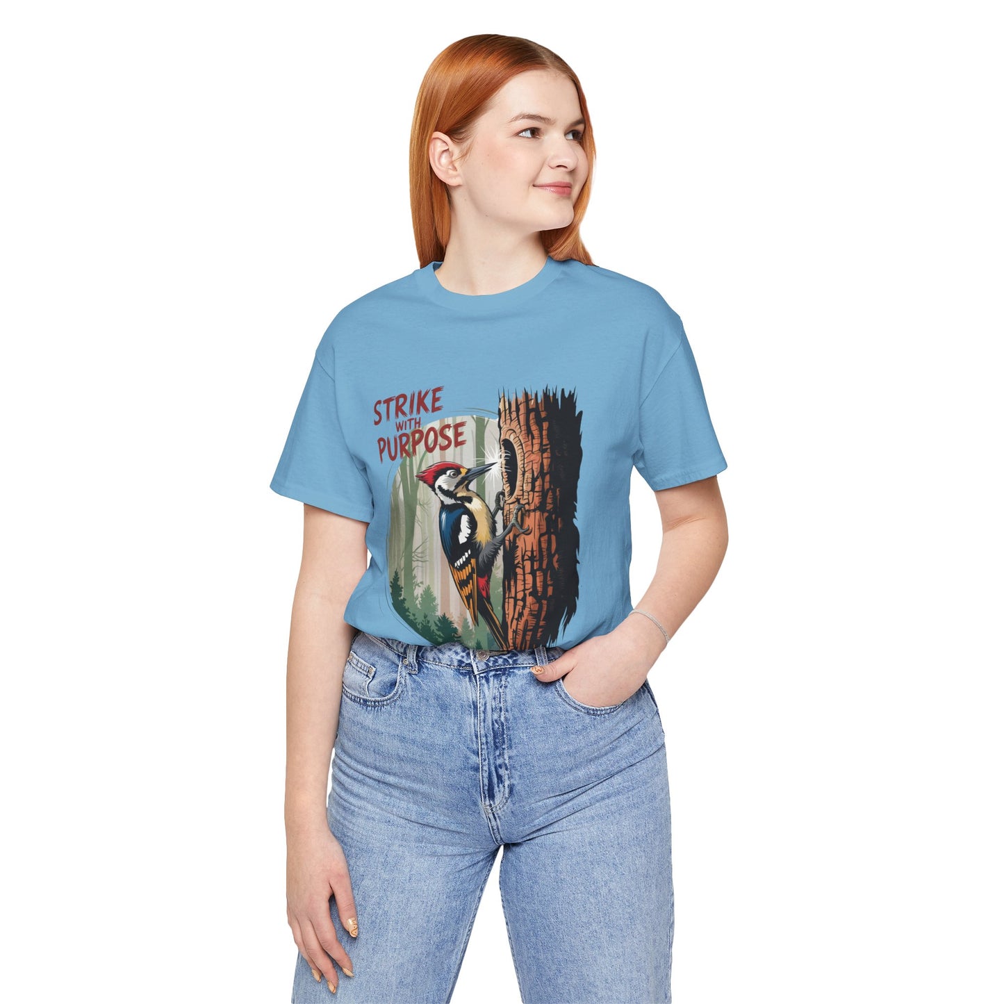 Woodpecker: Strike with Purpose Bella+Canvas Unisex T-Shirt featuring a woodpecker design and motivational message, perfect for nature enthusiasts and casual wear. Ideal for those seeking unique, uplifting apparel.