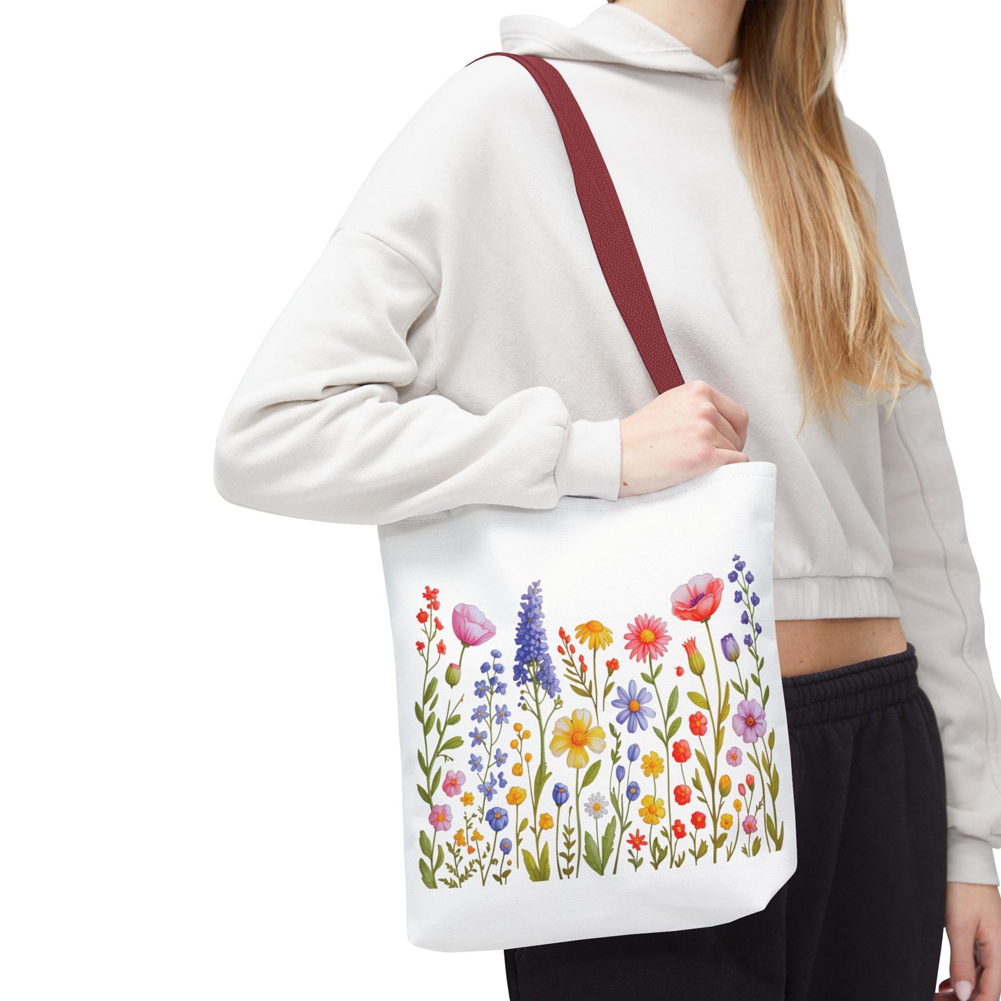 Wildflowers Tote Bag featuring a vibrant wildflower design, embodies a free-spirited essence. Ideal for nature lovers, this durable polyester bag, with reinforced handles, suits everyday adventures.