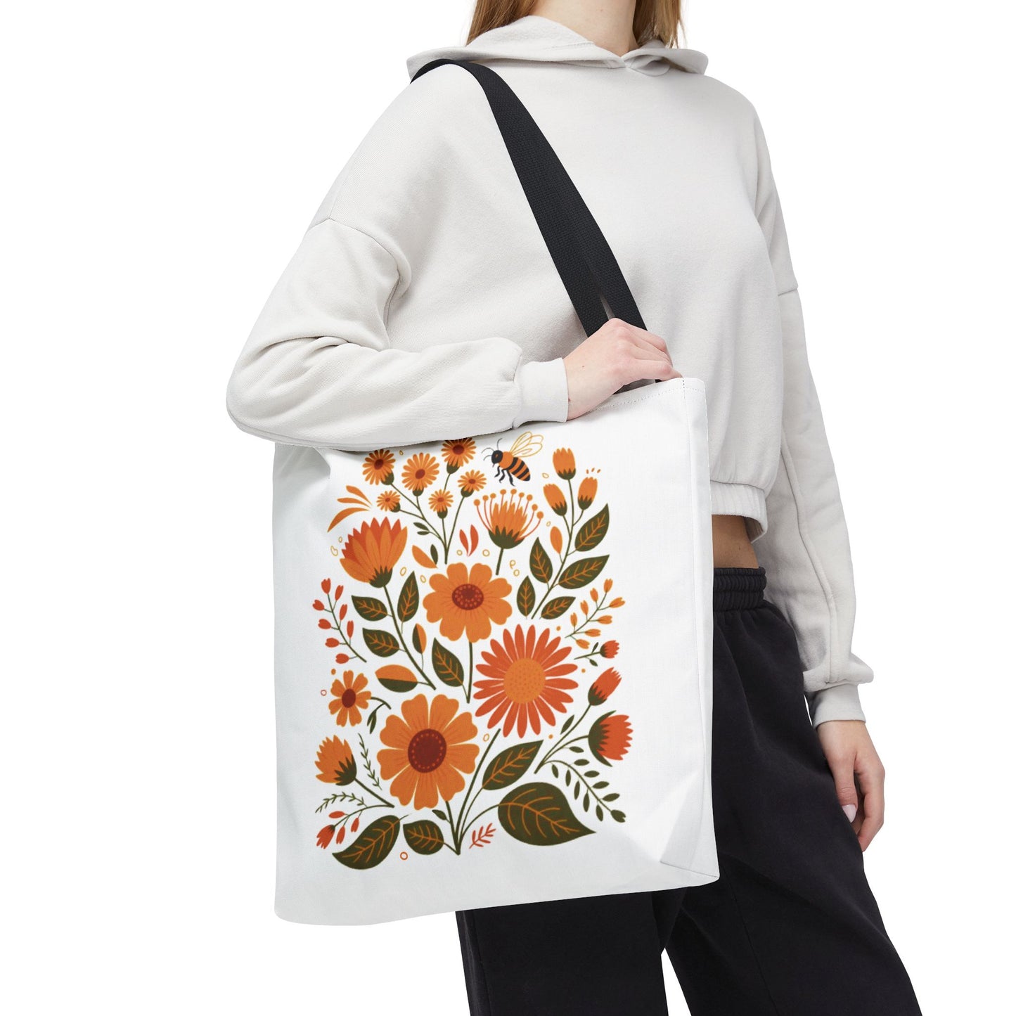 Folk Floral Tote Bag showcasing hand-drawn wildflowers in warm tones, ideal for nature enthusiasts. Features durable polyester, reinforced handles, and boxed corners, offering style and practicality for everyday use.