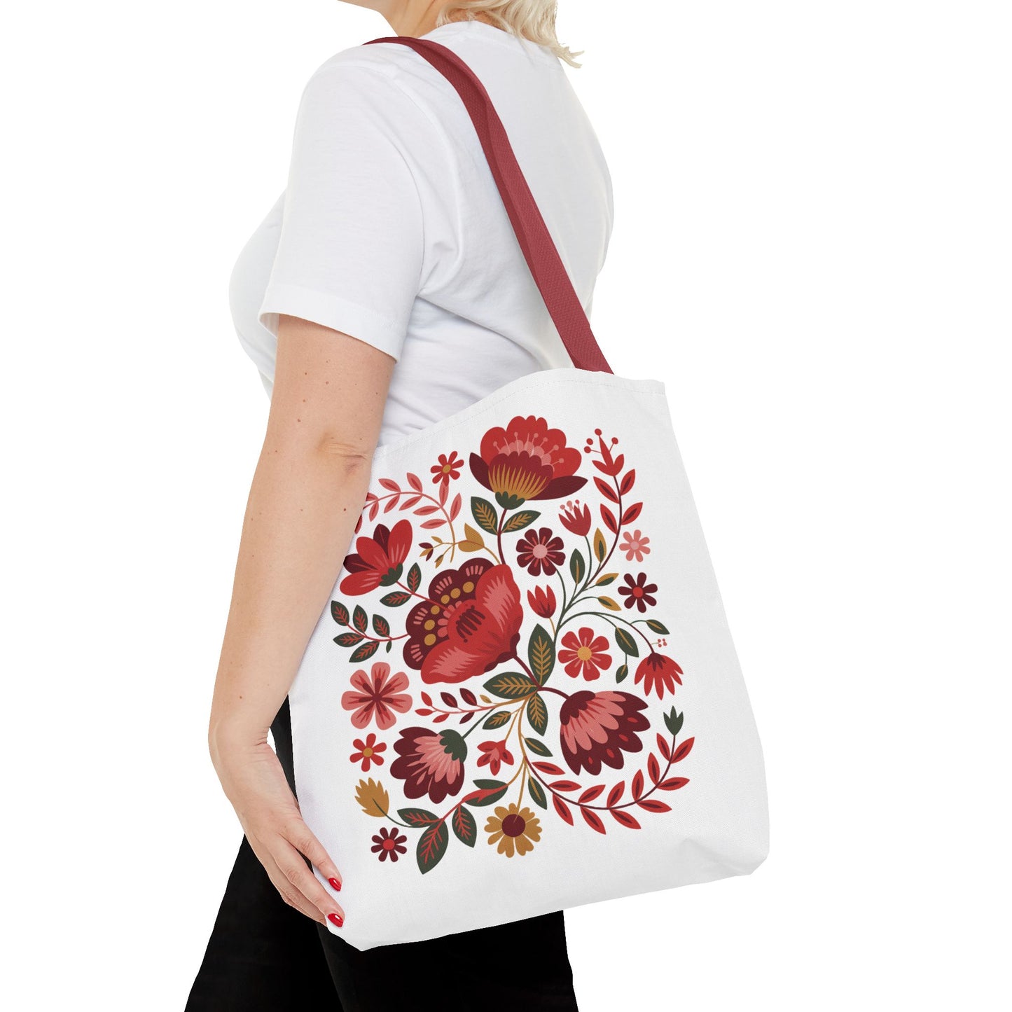 Red Floral Folk-Art Style Tote Bag featuring lively organic floral illustrations in red tones, complemented by soft blush, blue, and green leaves. Ideal for vibrant, everyday use.