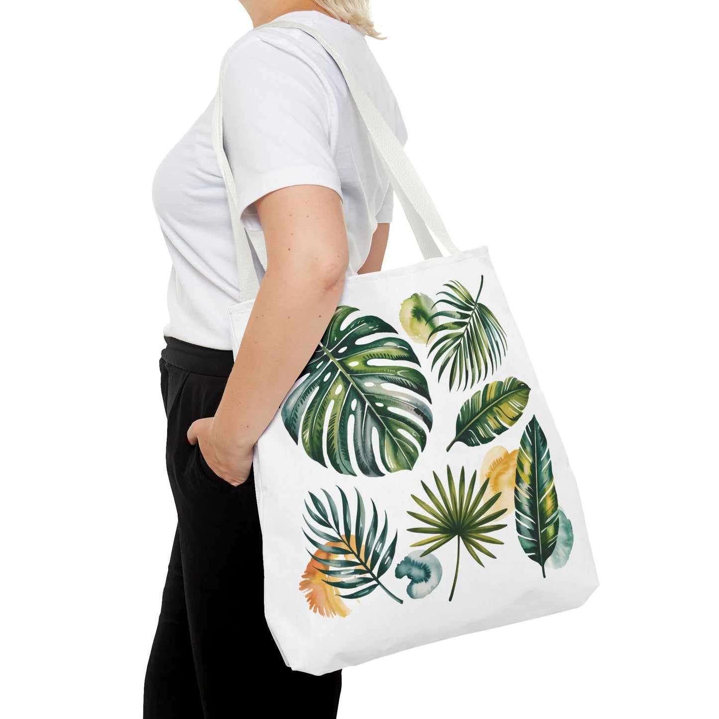 Tropical Leaves Tote Bag, showcasing a vibrant leaf pattern, embodies a fresh, summery vibe. Ideal for beach outings or shopping, it combines style with durability, reflecting FireBrook Designs' commitment to joyful, uplifting products.