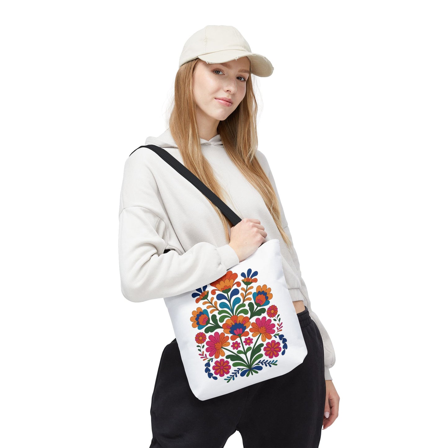 Red Folk-Art Floral Tote Bag featuring a vibrant folk-art style floral illustration in red tones with blush, blue, and green accents. Ideal for groceries, books, or essentials, offering both style and practicality.