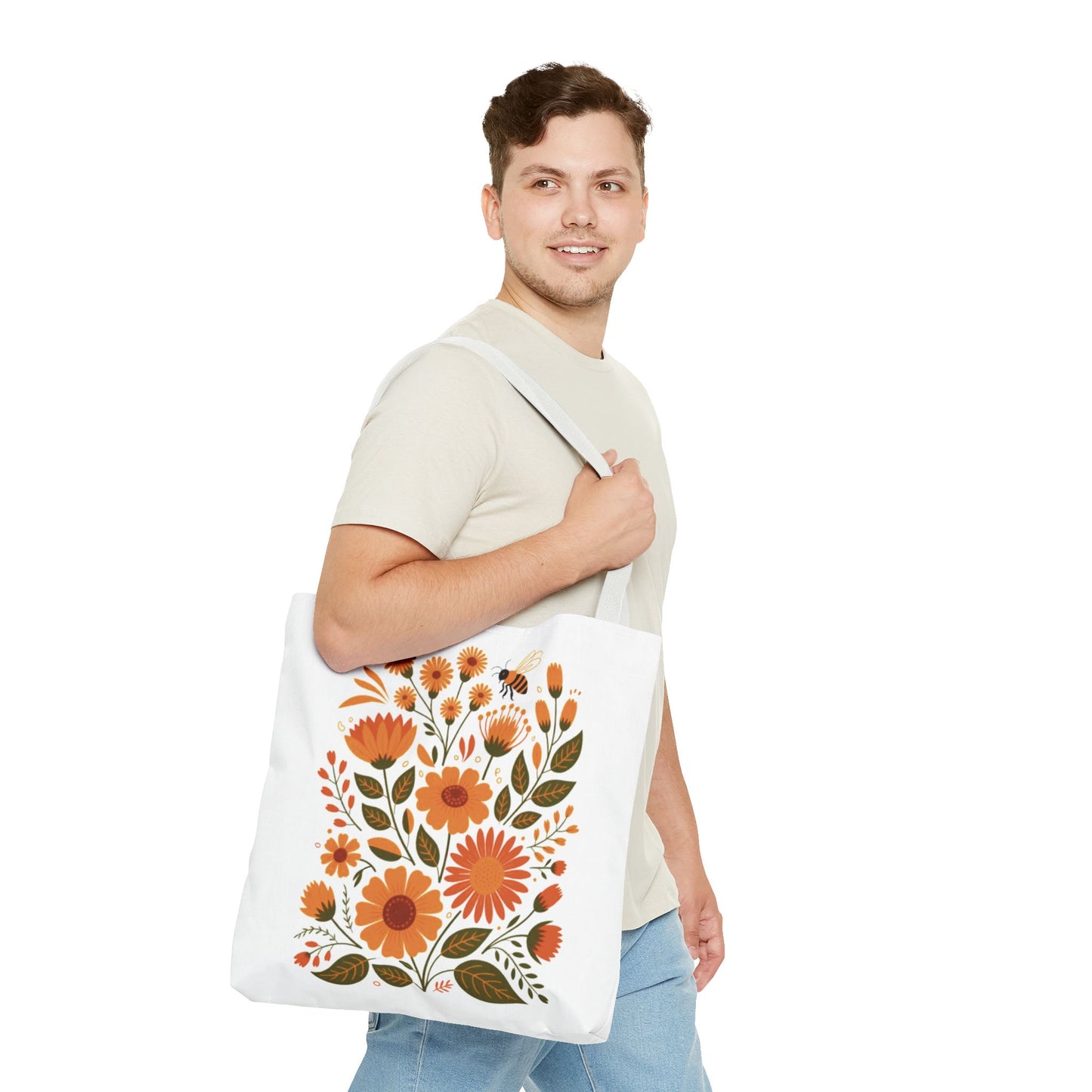 Folk Floral Tote Bag featuring vibrant hand-drawn wildflowers in warm hues, ideal for everyday use. Made from durable polyester with reinforced handles, available in three sizes for versatile, stylish carrying.