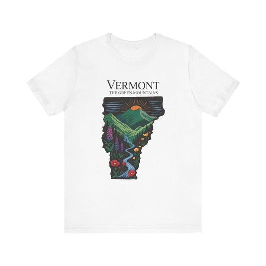 Vermont: The Green Mountains Bella+Canvas Unisex T-Shirt featuring a vibrant graphic of a mountain landscape with a river, ideal for nature enthusiasts, blending casual comfort and outdoor style.