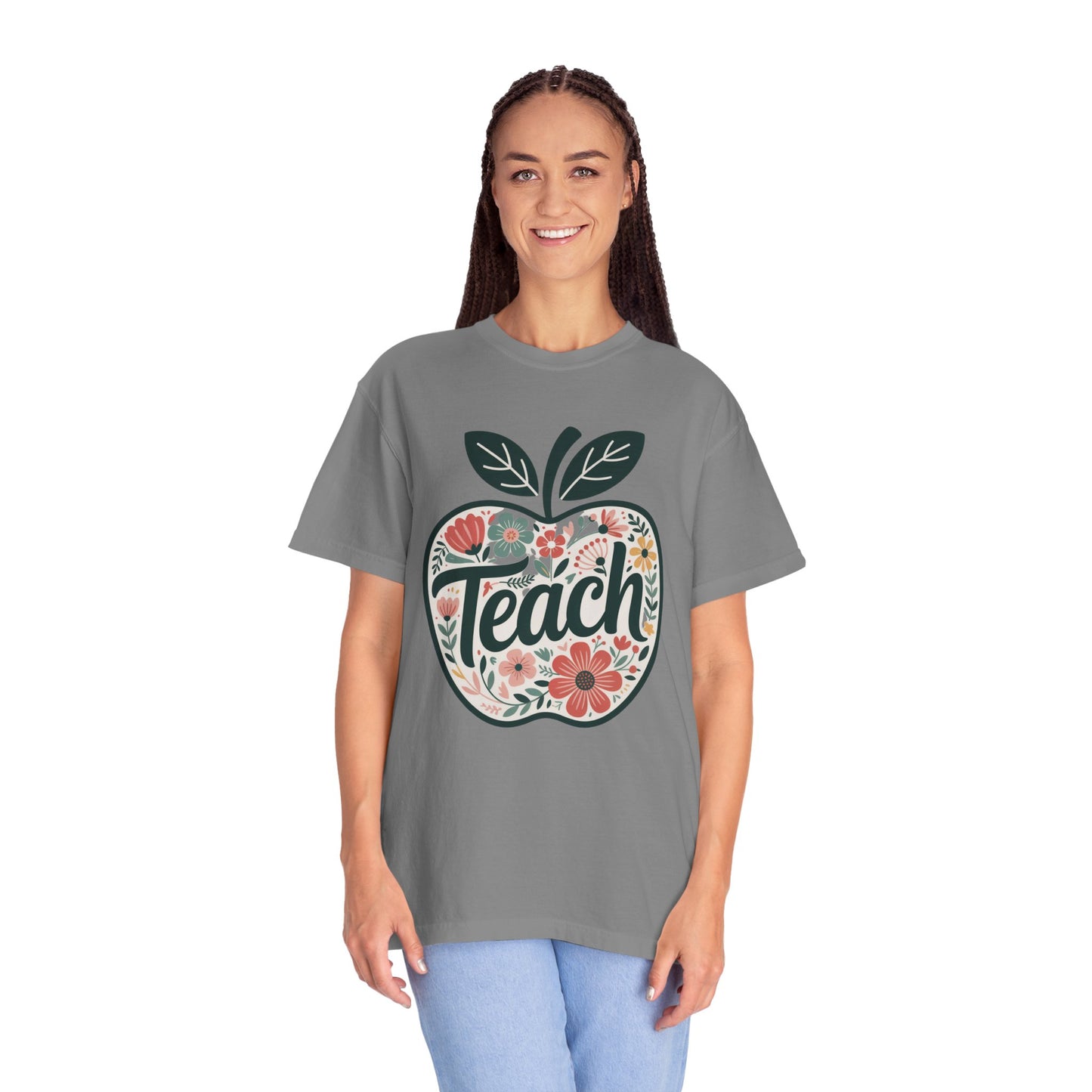 Floral Apple TEACH T-shirt showcases a whimsical apple filled with pastel florals and TEACH script, embodying FireBrook Essentials' uplifting, stylish apparel for educators and nature enthusiasts.