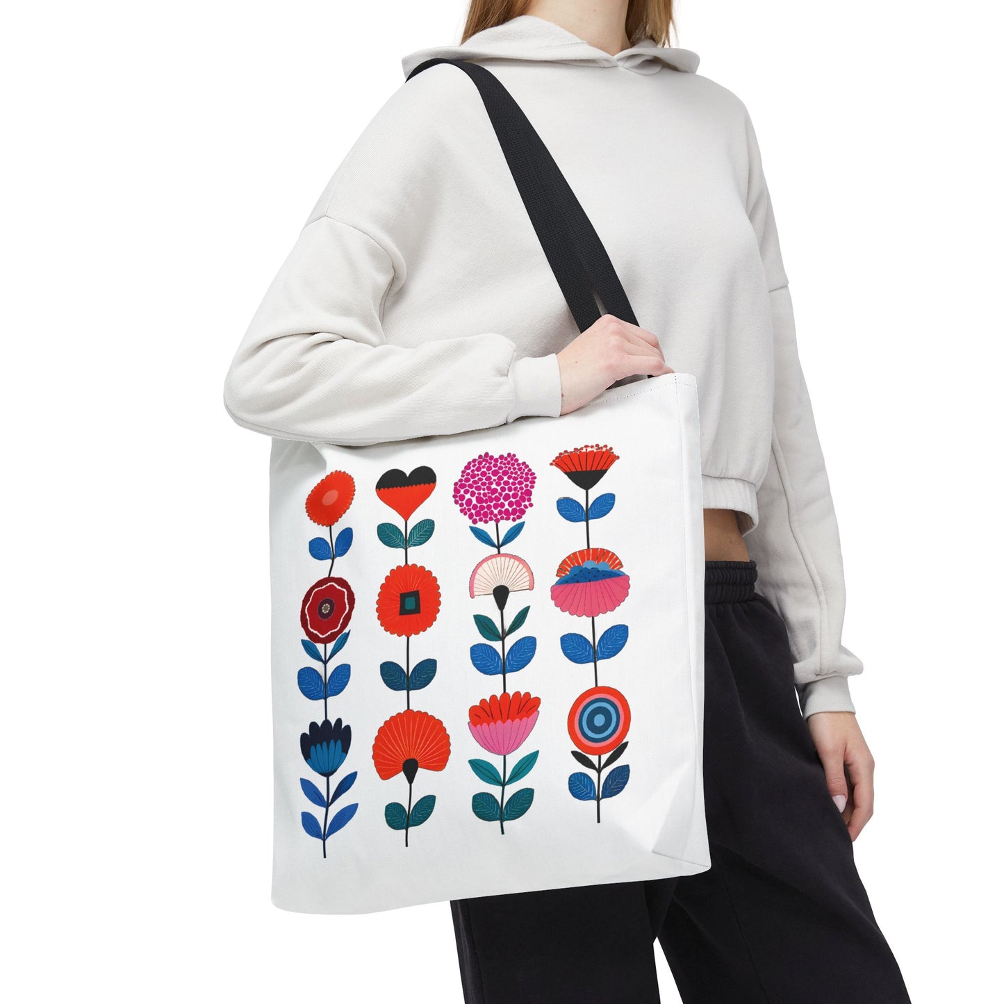 Woman holding a Floral Pattern Tote Bag with a vibrant floral design, showcasing its spacious and durable features ideal for daily use.