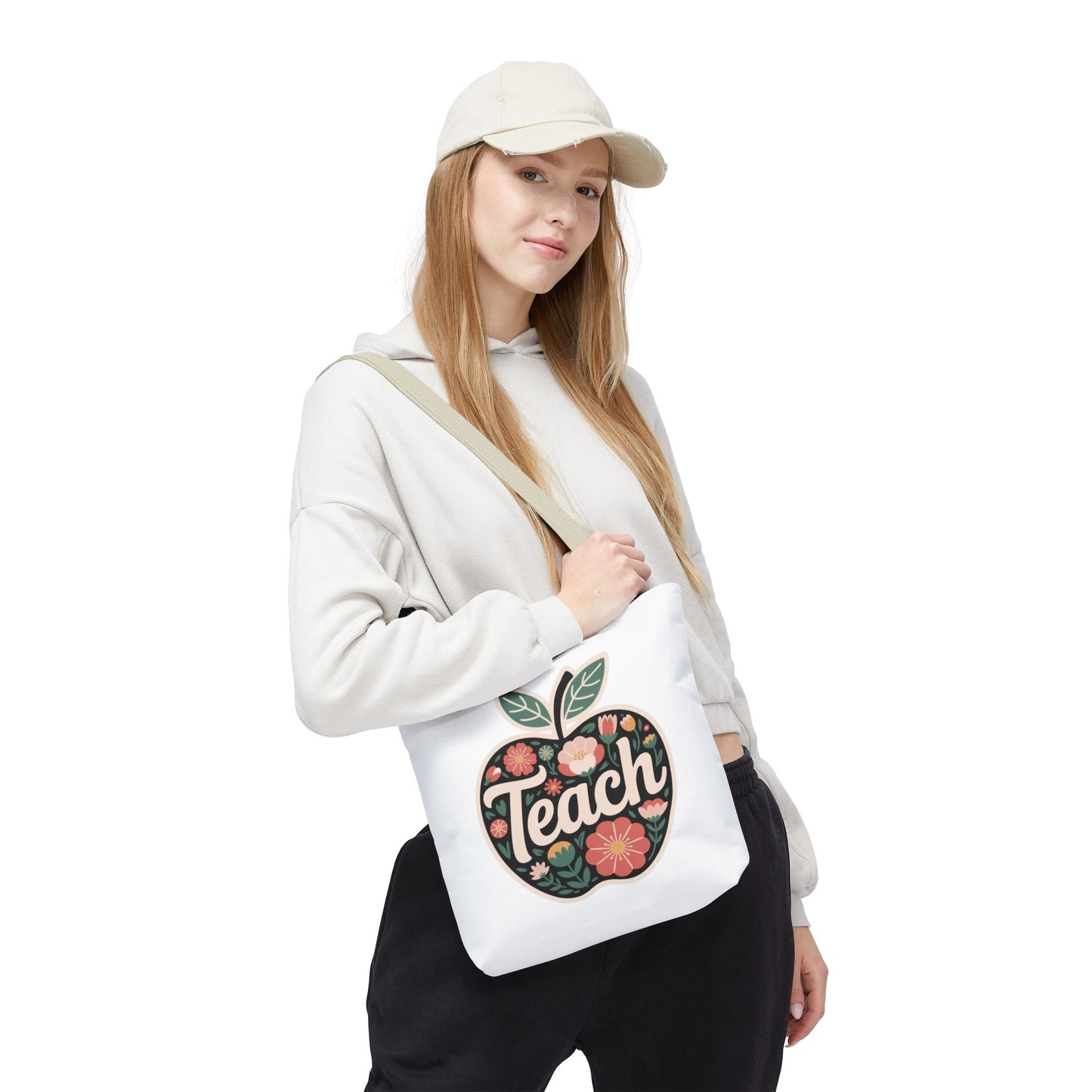 Floral Apple Tote Bag - Hand-Drawn Pastel-Colored Design with 'TEACH' features an apple-shaped design with pastel floral illustrations. Ideal for educators, it blends style and practicality, embodying FireBrook Essentials' uplifting spirit.