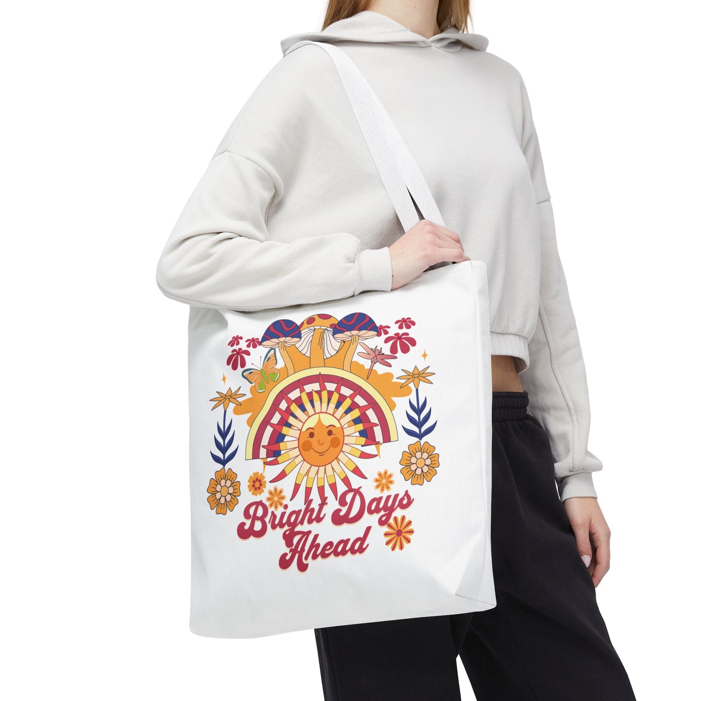 Bright Days Ahead Sunshine Floral Tote Bag adorned with cheerful sunshine, flowers, and butterflies, perfect for joyful outings. Durable polyester with reinforced handles, available in various sizes from FireBrook Essentials.