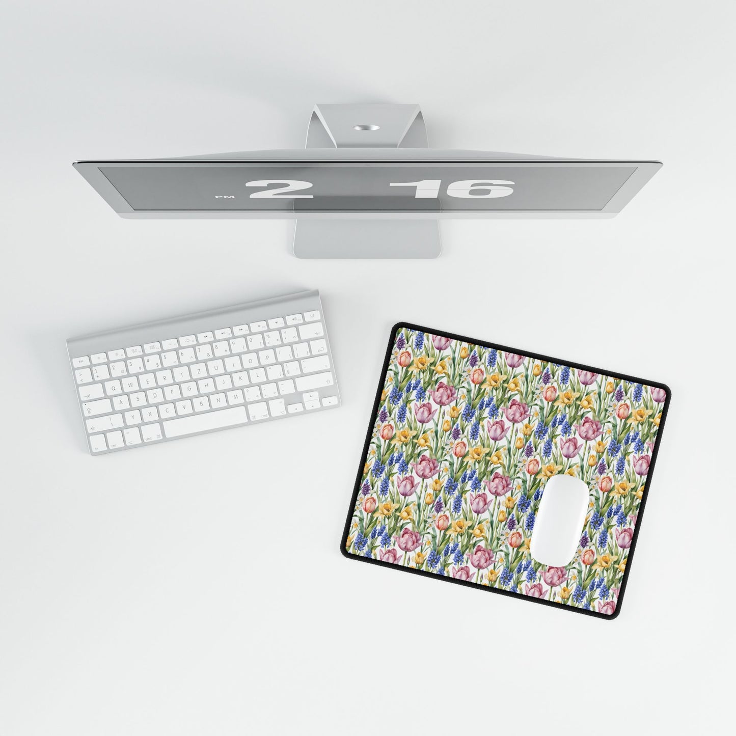 Desk Mat - Spring Garden Tulips Daffodils Hyacinths displayed with a computer setup, showcasing its floral design and smooth, vibrant surface ideal for creating a serene workspace.
