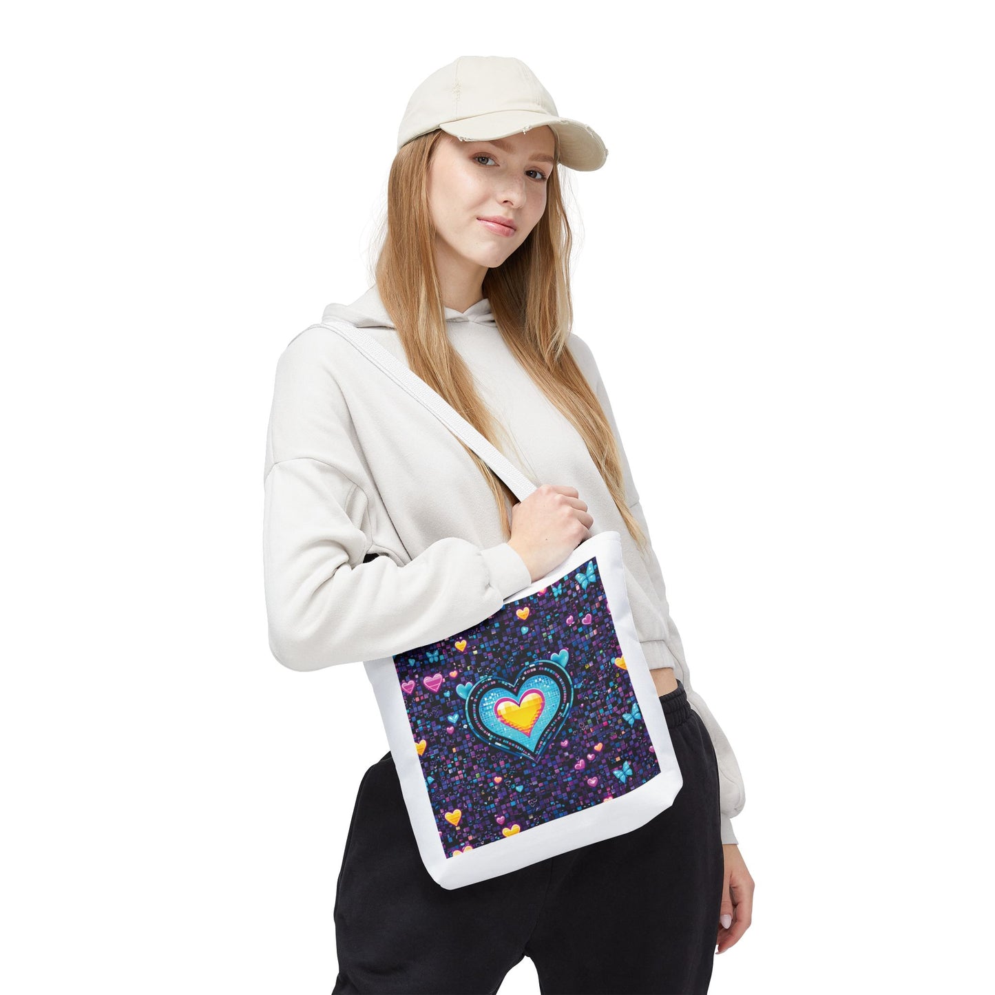 Heart Pixelated Nostalgic Cyber-Aesthetic Tote Bag held by a woman in a white hoodie, showcasing its unique, trendy design perfect for stylish everyday use.