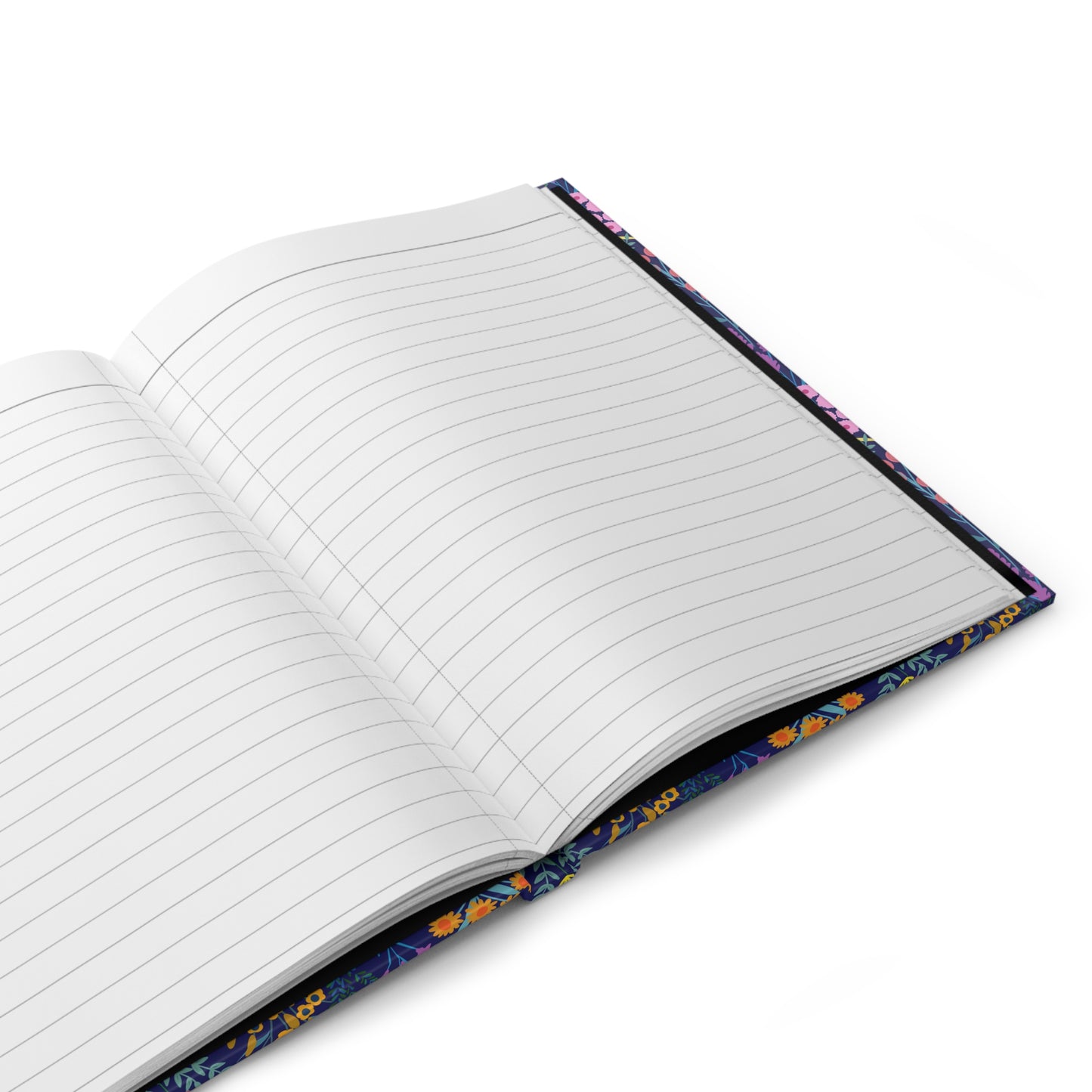 HARDCOVER JOURNAL, MATTE, RULED, 5X7, SEWN BIND, CLEAN-TEAR PAGES - FLORAL MEADOWS features open pages with ruled lines, set against a vibrant floral-patterned cover on a white surface.