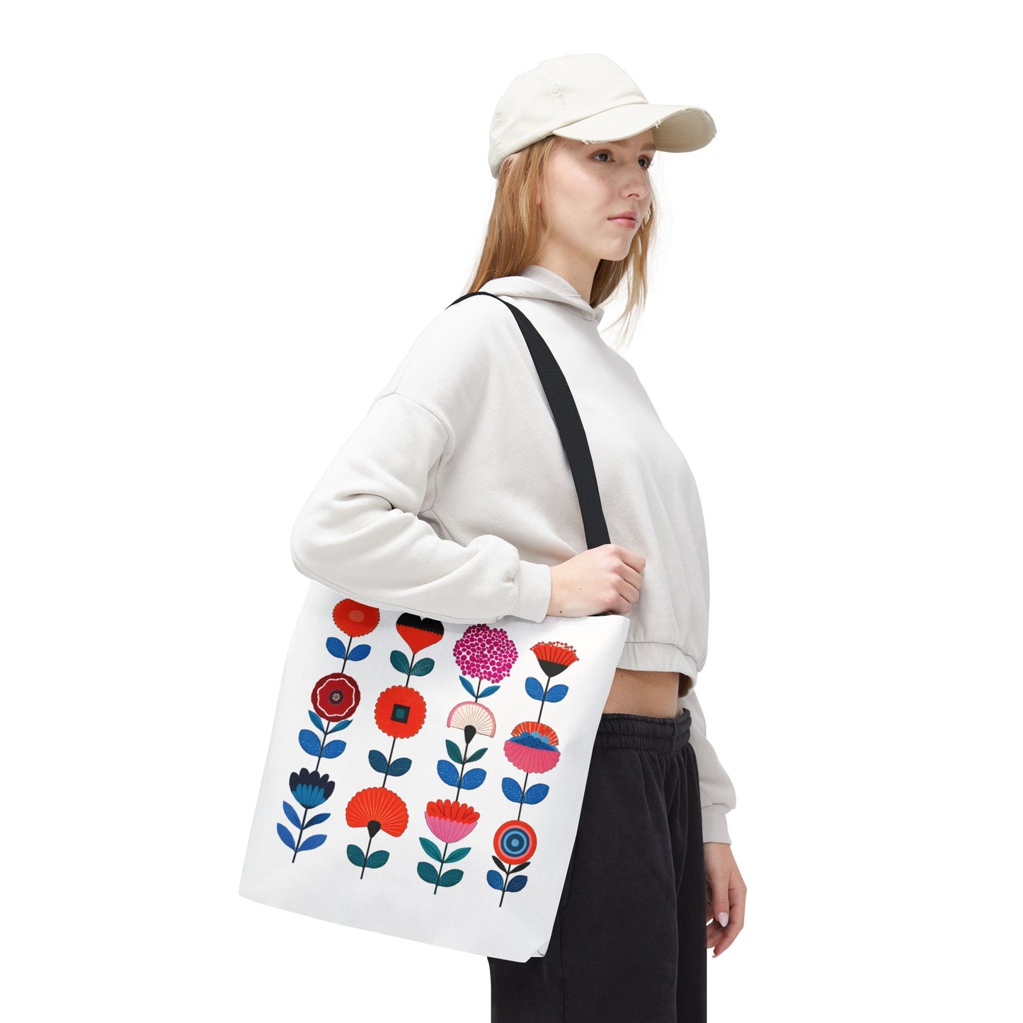 Woman in white hat holding Floral Pattern Tote Bag, showcasing its stylish floral design and functionality.