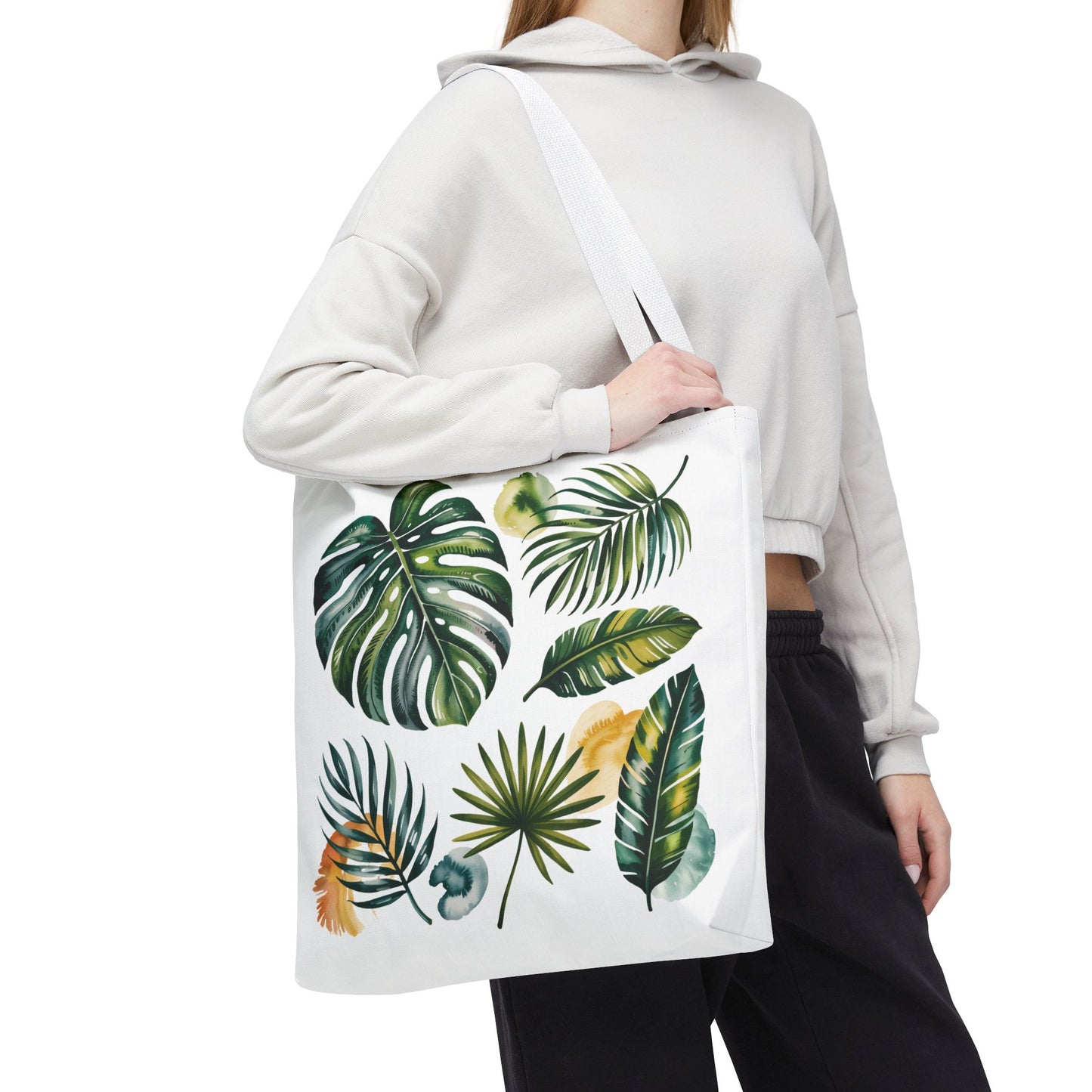 Tropical Leaves Tote Bag featuring a vibrant leaf pattern, showcasing its spacious, durable design with reinforced handles, perfect for stylish beach outings and everyday use, embodying FireBrook Essentials' uplifting, practical style.