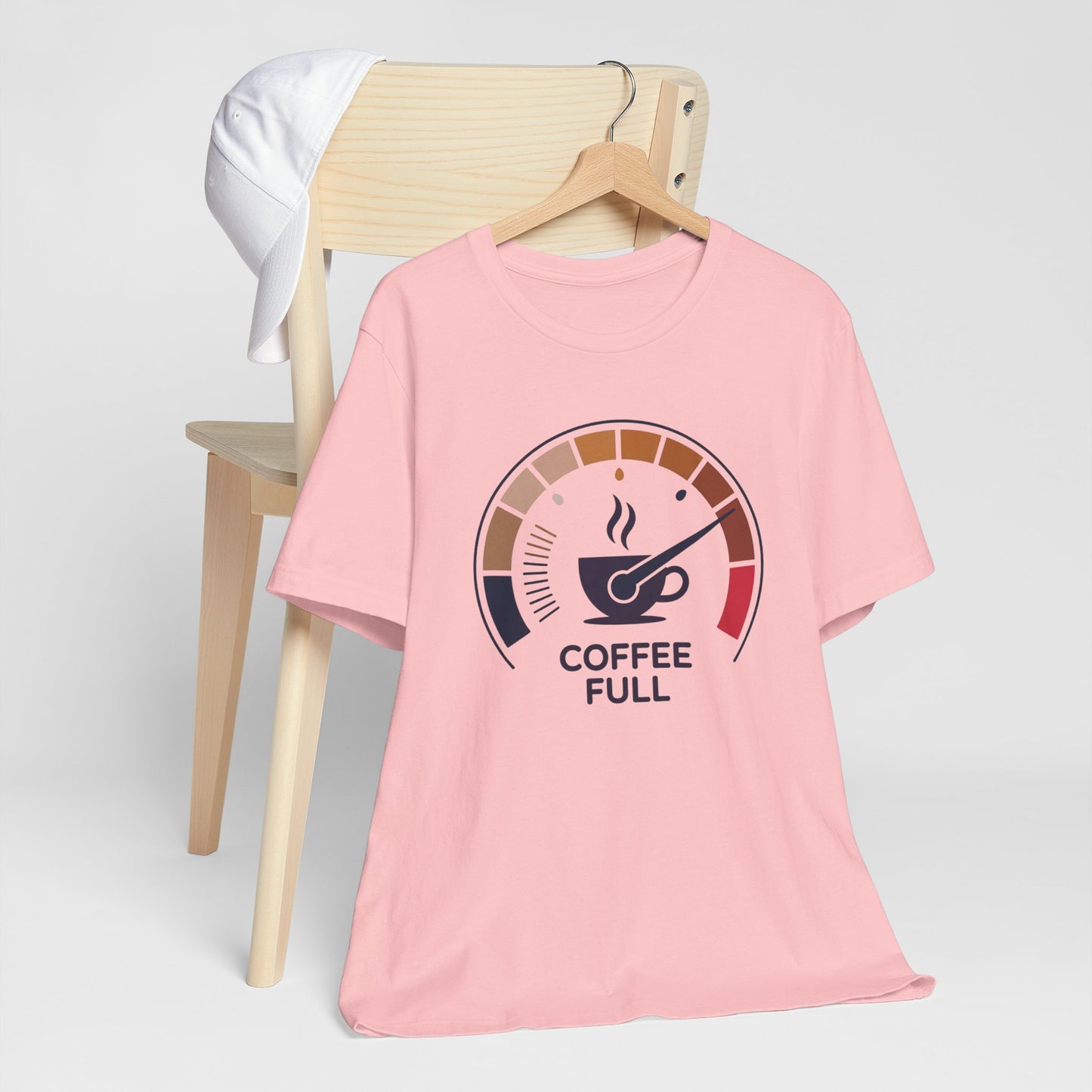 Coffee Full Bella+Canvas Unisex T-Shirt draped on a chair, showcasing its lightweight, high-quality design ideal for coffee enthusiasts, embodying FireBrook Essentials' commitment to comfort and style.