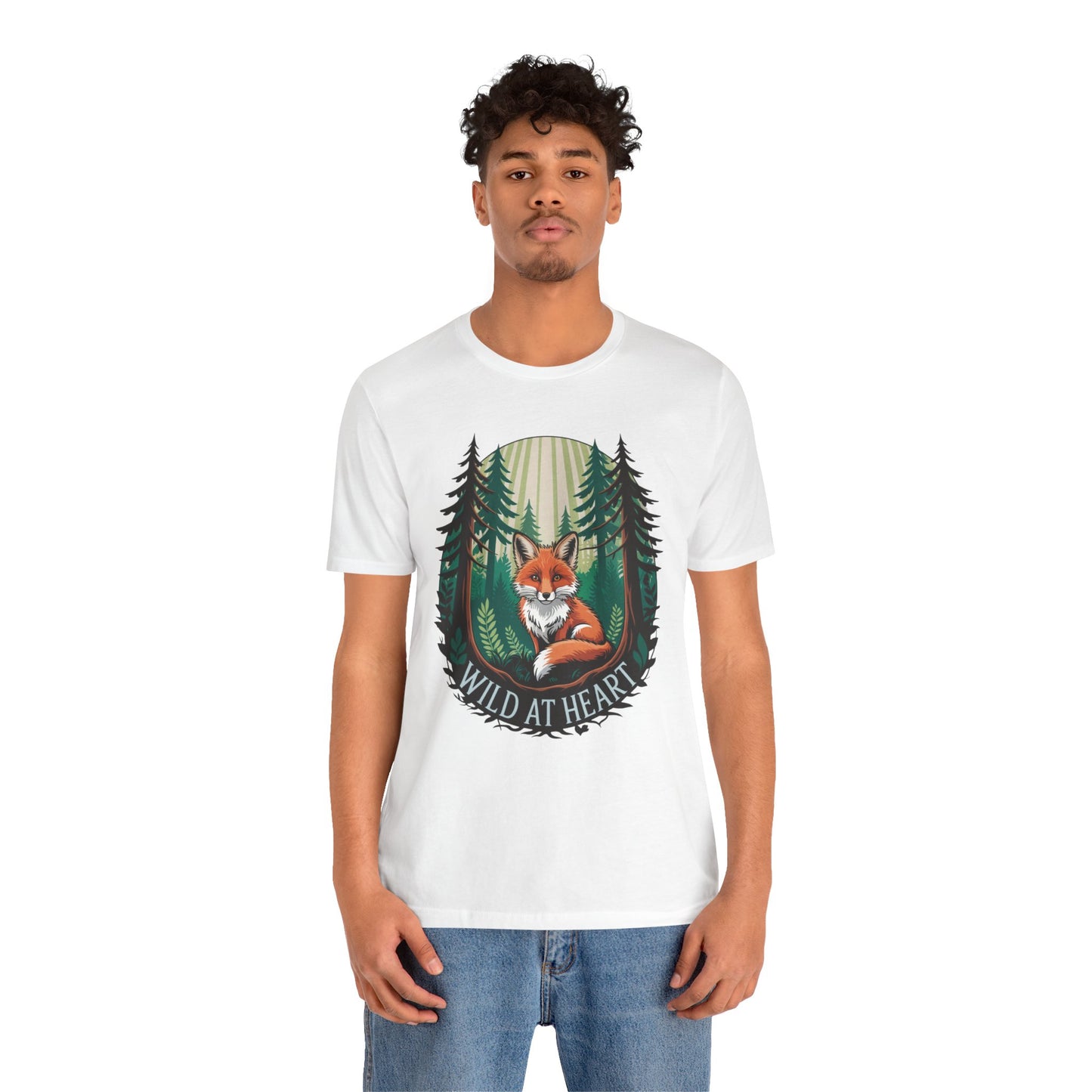 Wild at Heart Fox Illustration Bella+Canvas Unisex T-Shirt shows a man in a white tee featuring a fox in the woods, highlighting its casual, animal-themed design. Perfect for nature lovers.