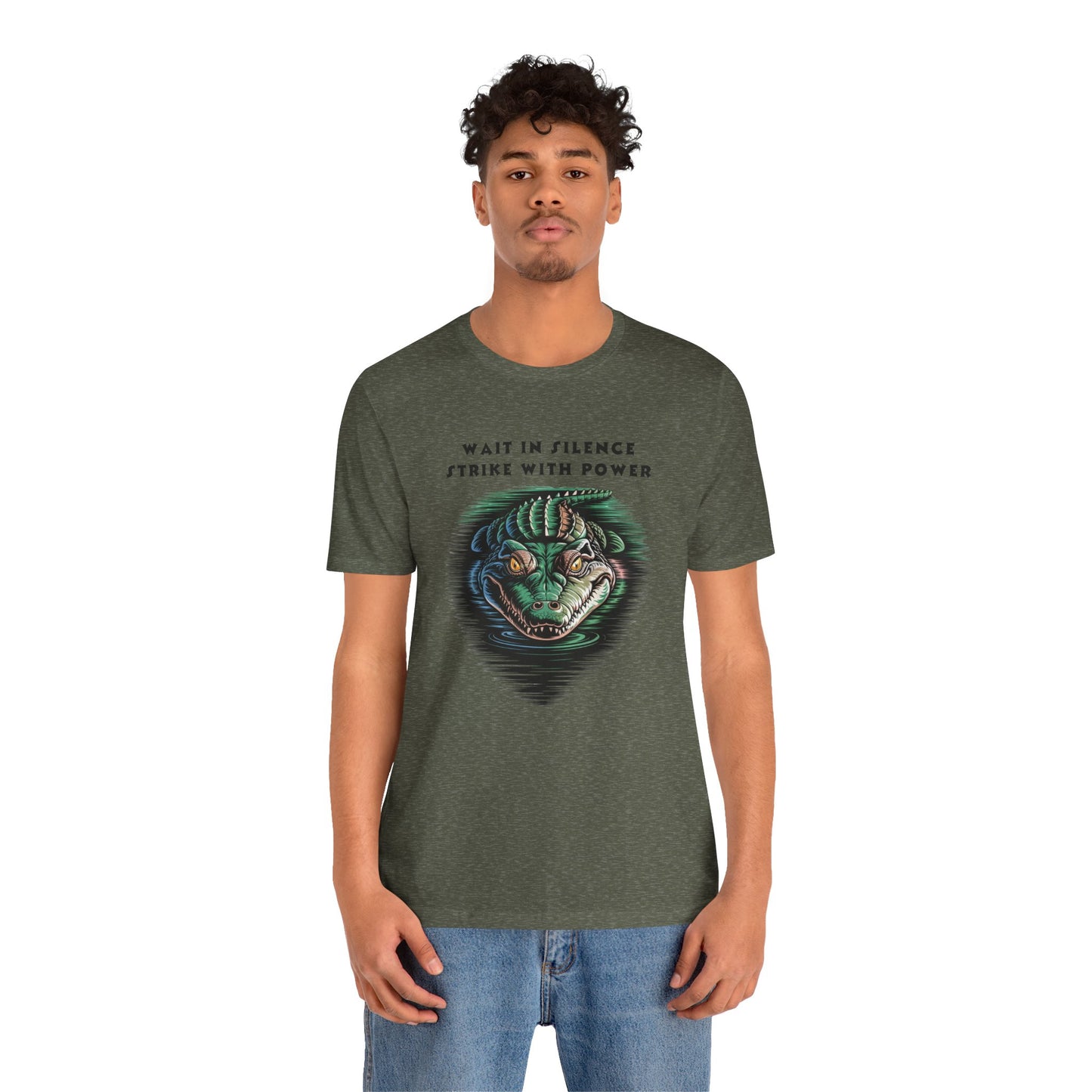 Crocodile: Walk in Silence, Strike with Purpose Bella+Canvas Unisex T-Shirt showcases a bold crocodile design, worn by a man. Perfect for casual wear, embodying stealth and determination.