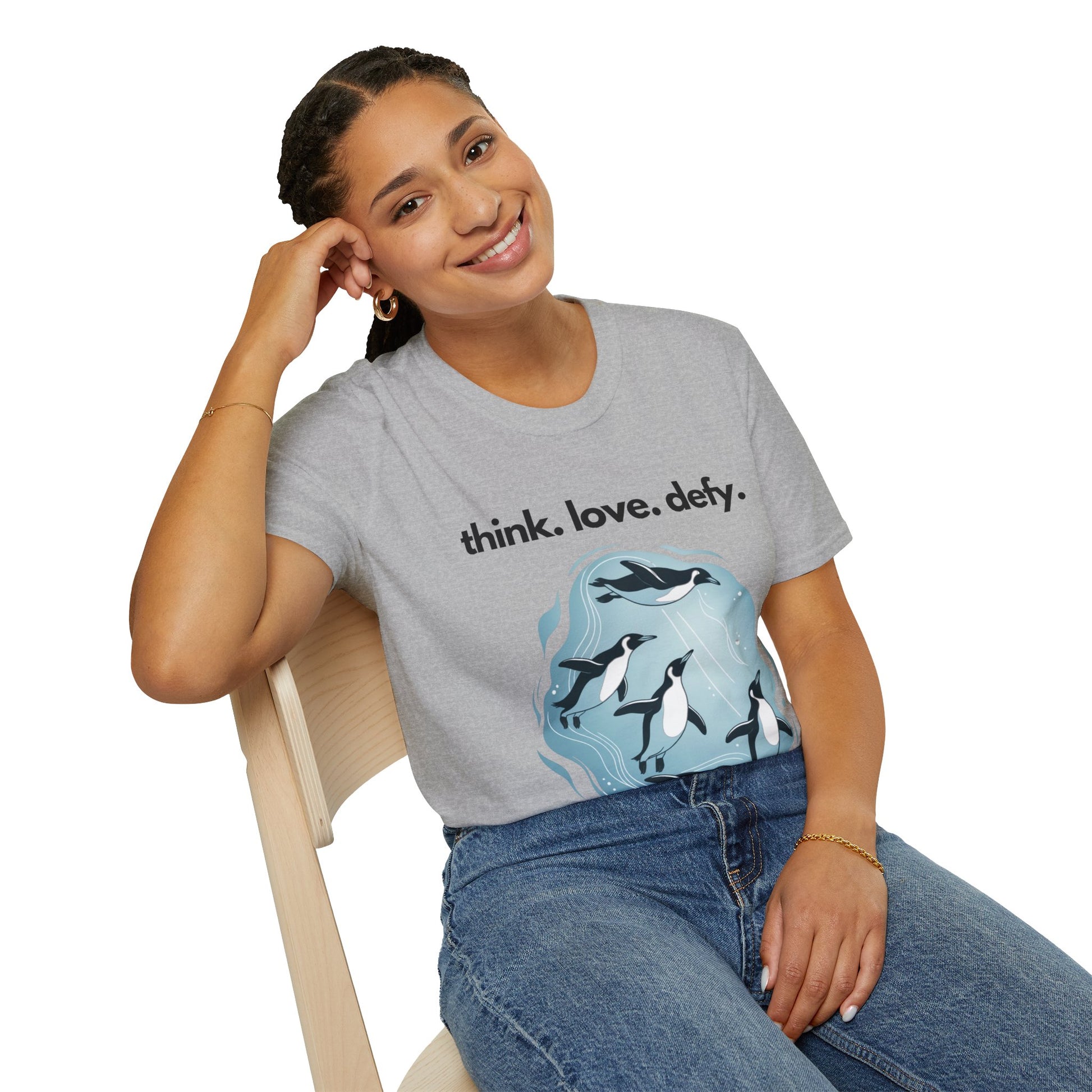 Woman smiling while wearing the Think Love Defy Penguin Animal Nature Gildan Unisex T-Shirt, showcasing a penguin design, perfect for casual and outdoor wear, embodying FireBrook Essentials' uplifting style.
