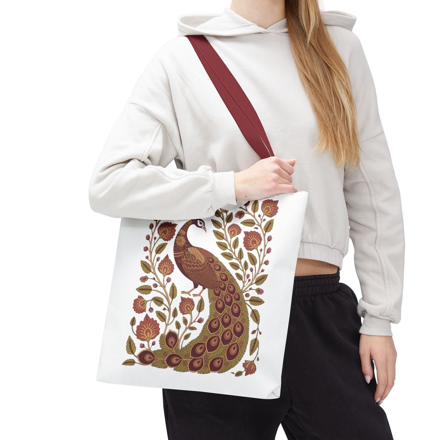 Peacock Tote Bag with Floral Vines and Paisley Motifs: A woman elegantly holds this FireBrook Designs tote, showcasing its central peacock and intricate patterns, perfectly embodying stylish functionality and uplifting design.