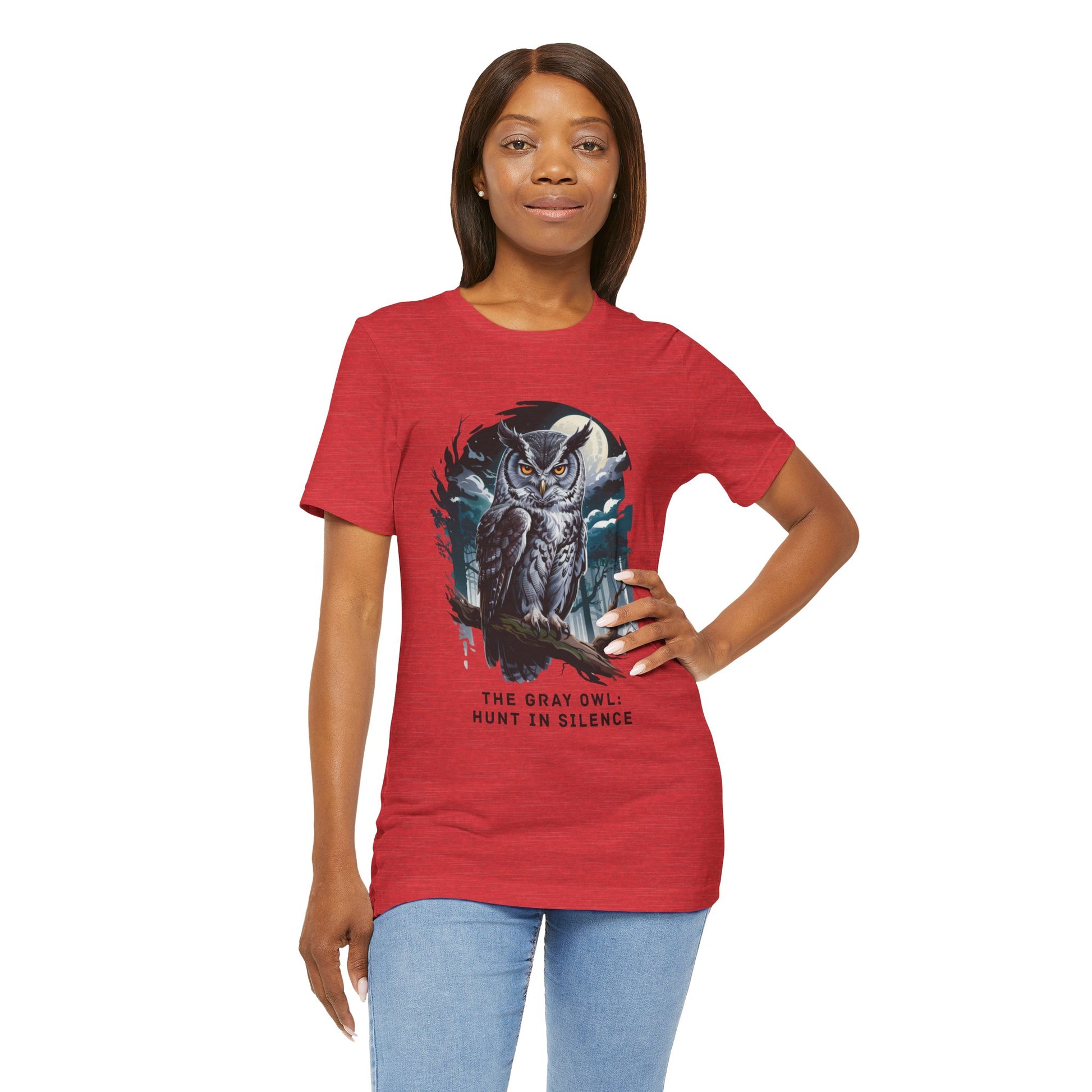 The Gray Owl: Hunt in Silence Bella+Canvas Unisex T-Shirt features a woman wearing this stylish tee, showcasing the owl print, perfect for casual wear and nature enthusiasts.