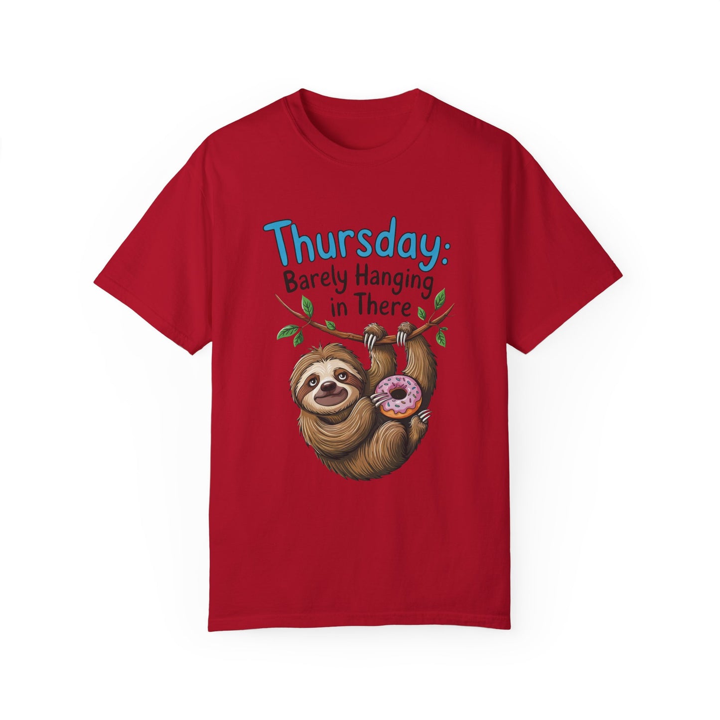 Thursday: Barely Hanging In There Sloth Graphic Comfort Colors Unisex T-Shirt featuring a playful sloth holding a donut. Ideal for comfort with a relaxed fit, echoing FireBrook Essentials' joyful and uplifting style.