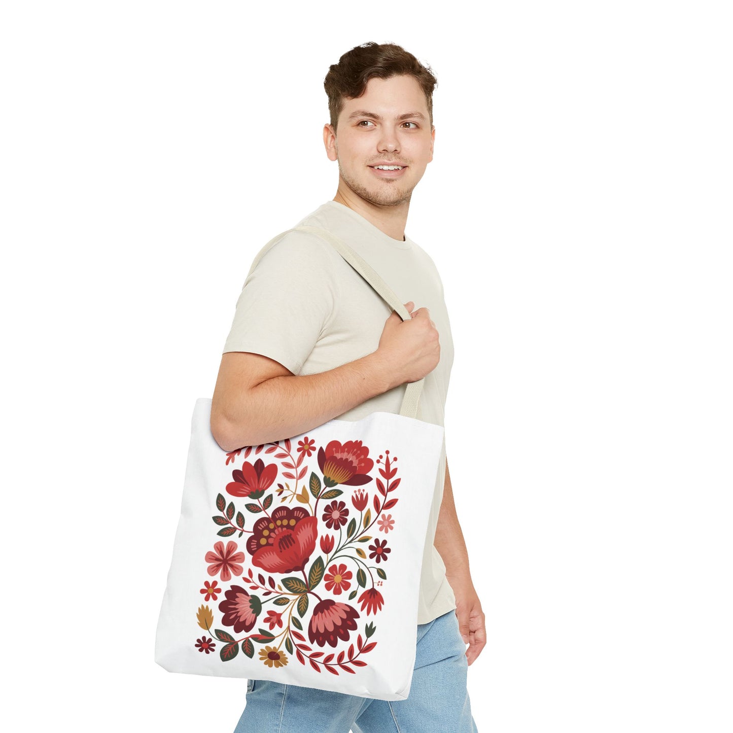 Red Floral Folk-Art Style Tote Bag featuring vibrant red, blush, and blue flowers with green leaves on a polyester body. Reinforced handles and boxed corners make it perfect for everyday use.
