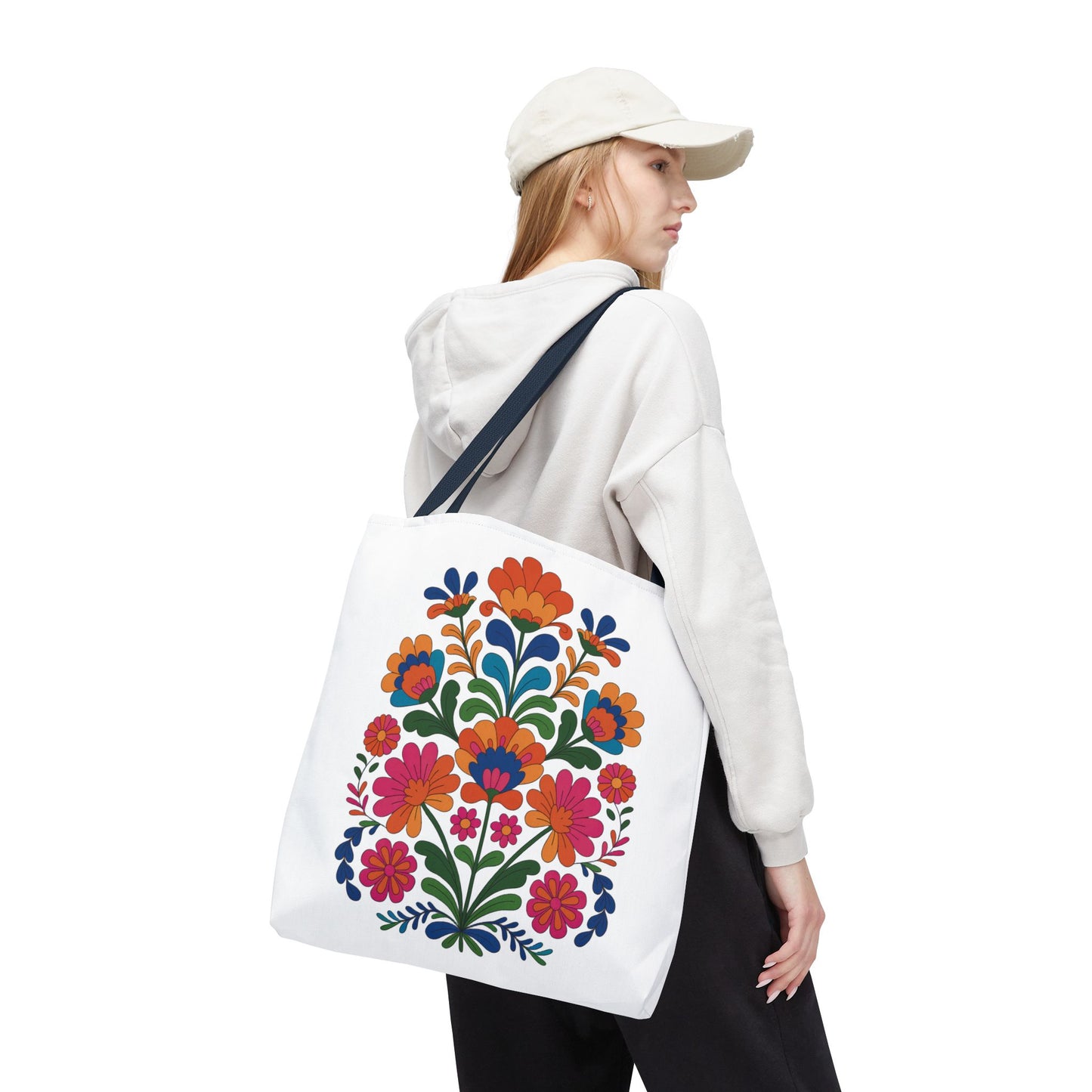 Red Folk-Art Floral Tote Bag with organic, lively floral illustration in reds and blues, complemented by green leaves. Features reinforced handles and boxed corners, ideal for everyday use and nature lovers.