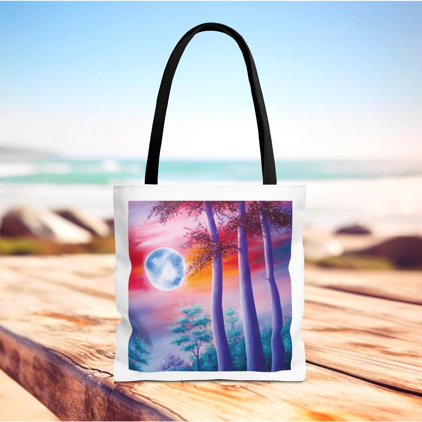 Moonlit Forest Tote Bag showcasing a mystical full moon scene with towering trees against a dramatic sunset sky, designed for art lovers. Made from durable polyester with reinforced handles, available in various sizes.