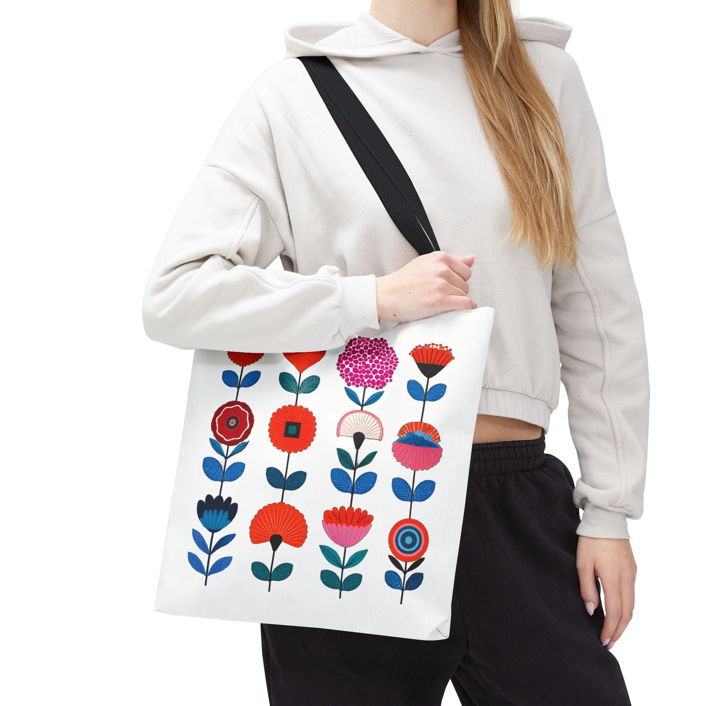 Floral Pattern Tote Bag featuring a woman holding it, showcasing a vibrant floral design. Ideal for versatile use, combining style and practicality.