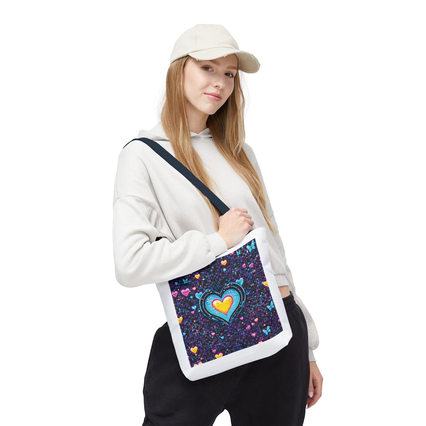 Woman wearing white attire holds the Heart Pixelated Nostalgic Cyber-Aesthetic Tote Bag, showcasing its unique Y2K-inspired design with pixelated hearts and butterflies.